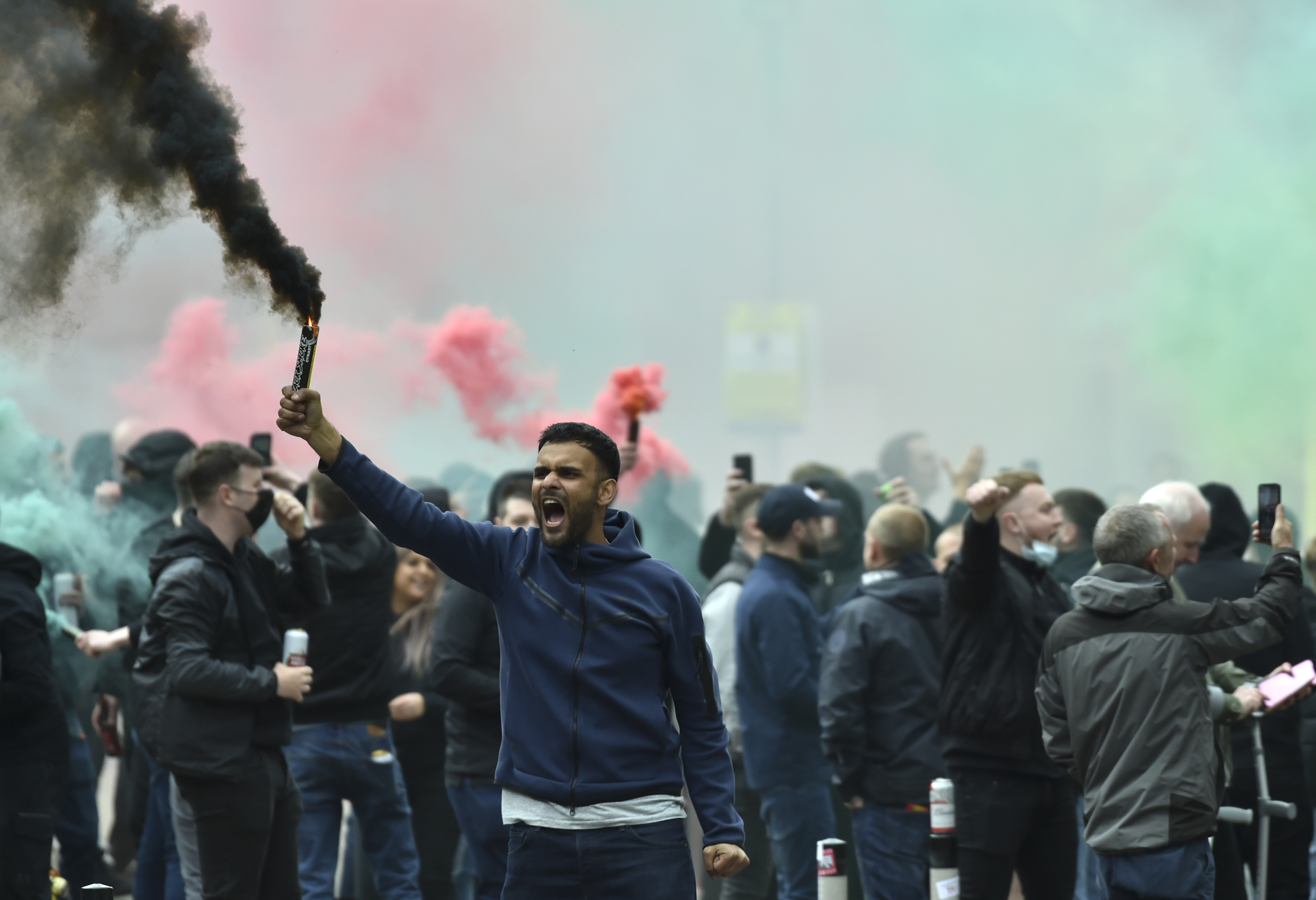Manchester United fans protest outside the Lowry Hotel where the team was staying during a protest against the Glazer family
