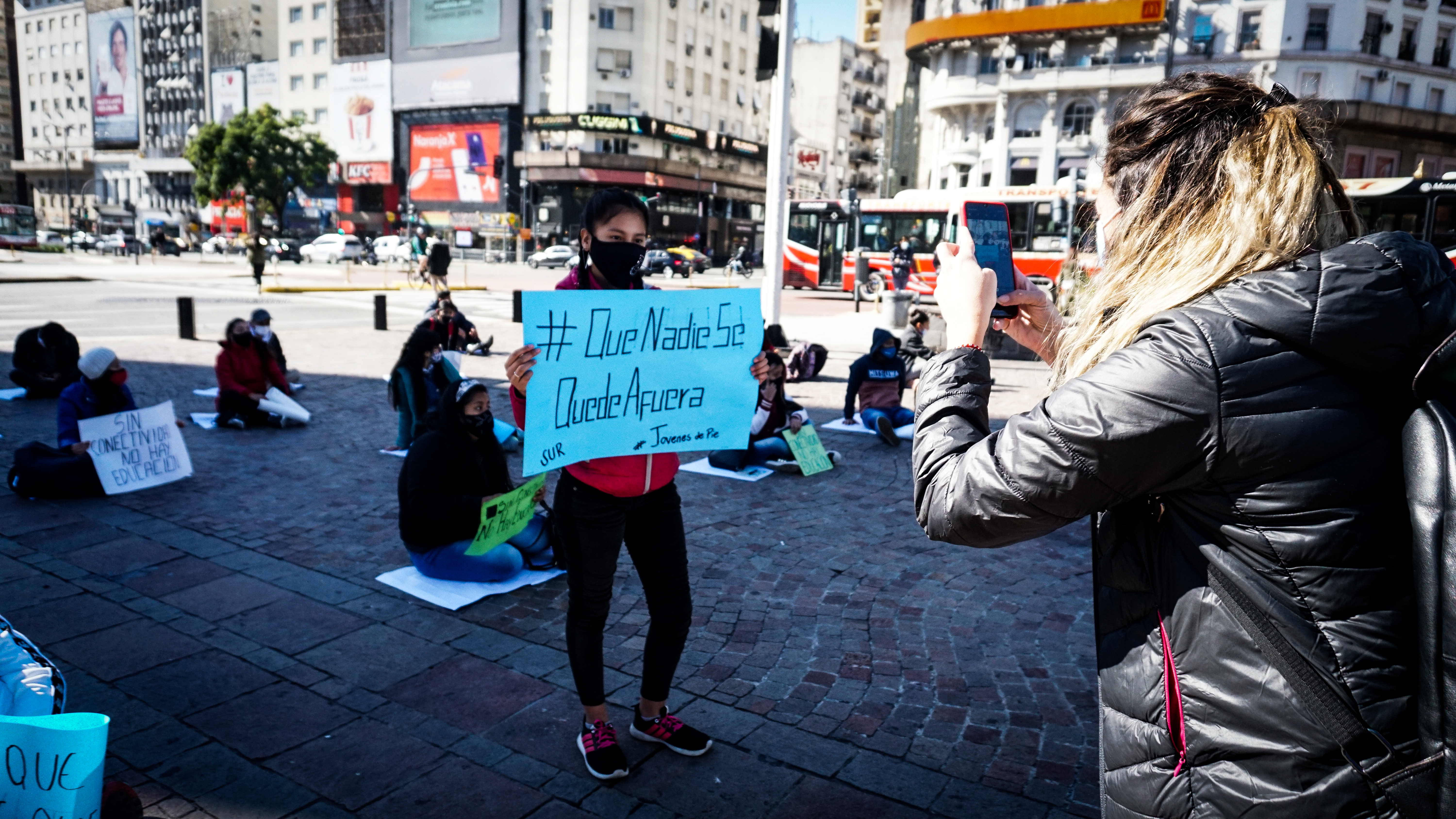 Nursing student Aldana Ramos holds a sign that reads ‘That No One Be Left Out’ during a protest demanding better internet connectivity and computers from the Argentine government on May 6 in Buenos Aires
