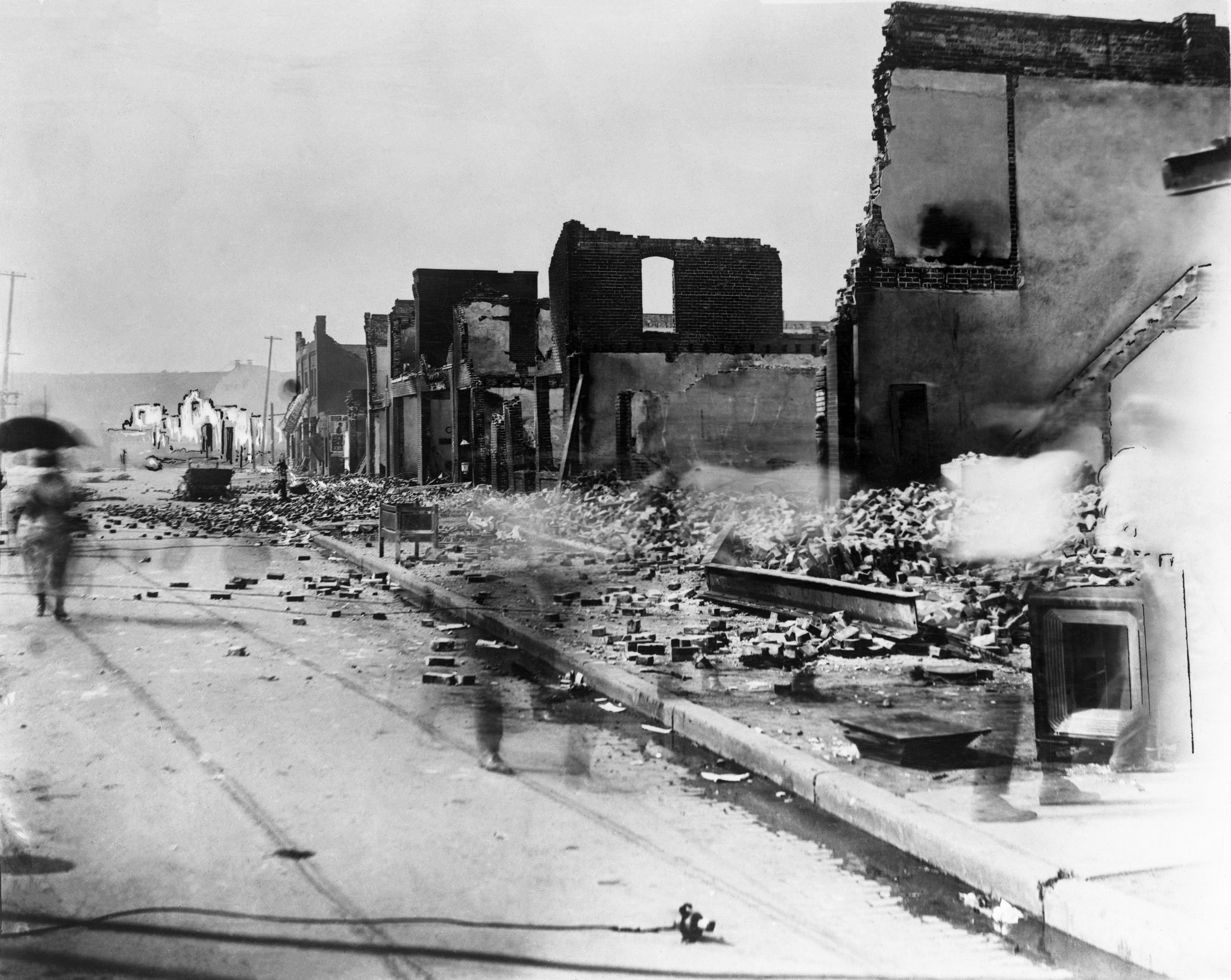 Photo shows the aftermath at the east corner of Greenwood Avenue and East Archer Street, in June 1921