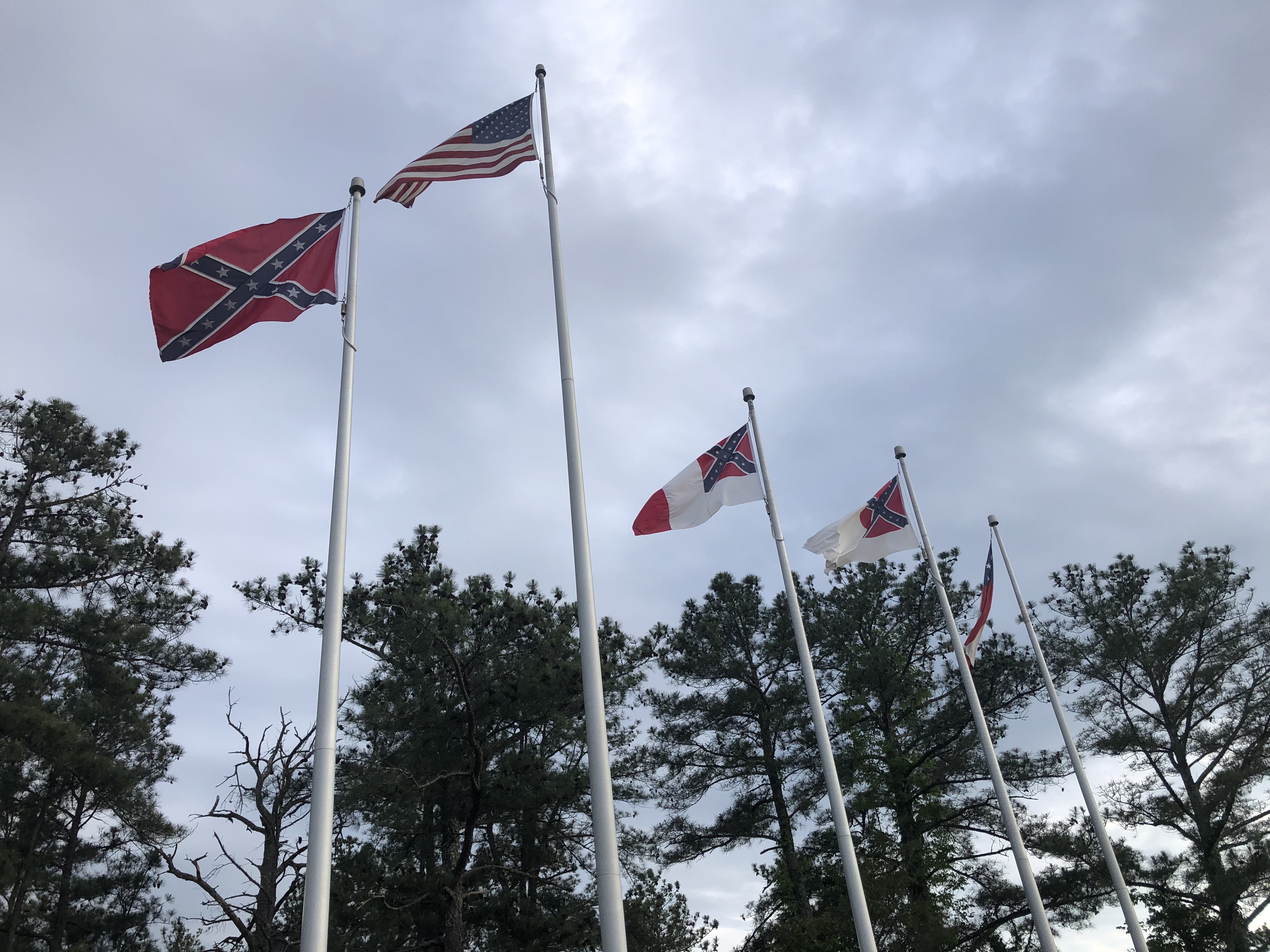 Confederate flags fly alongside the US flag in Stone Mountain Park