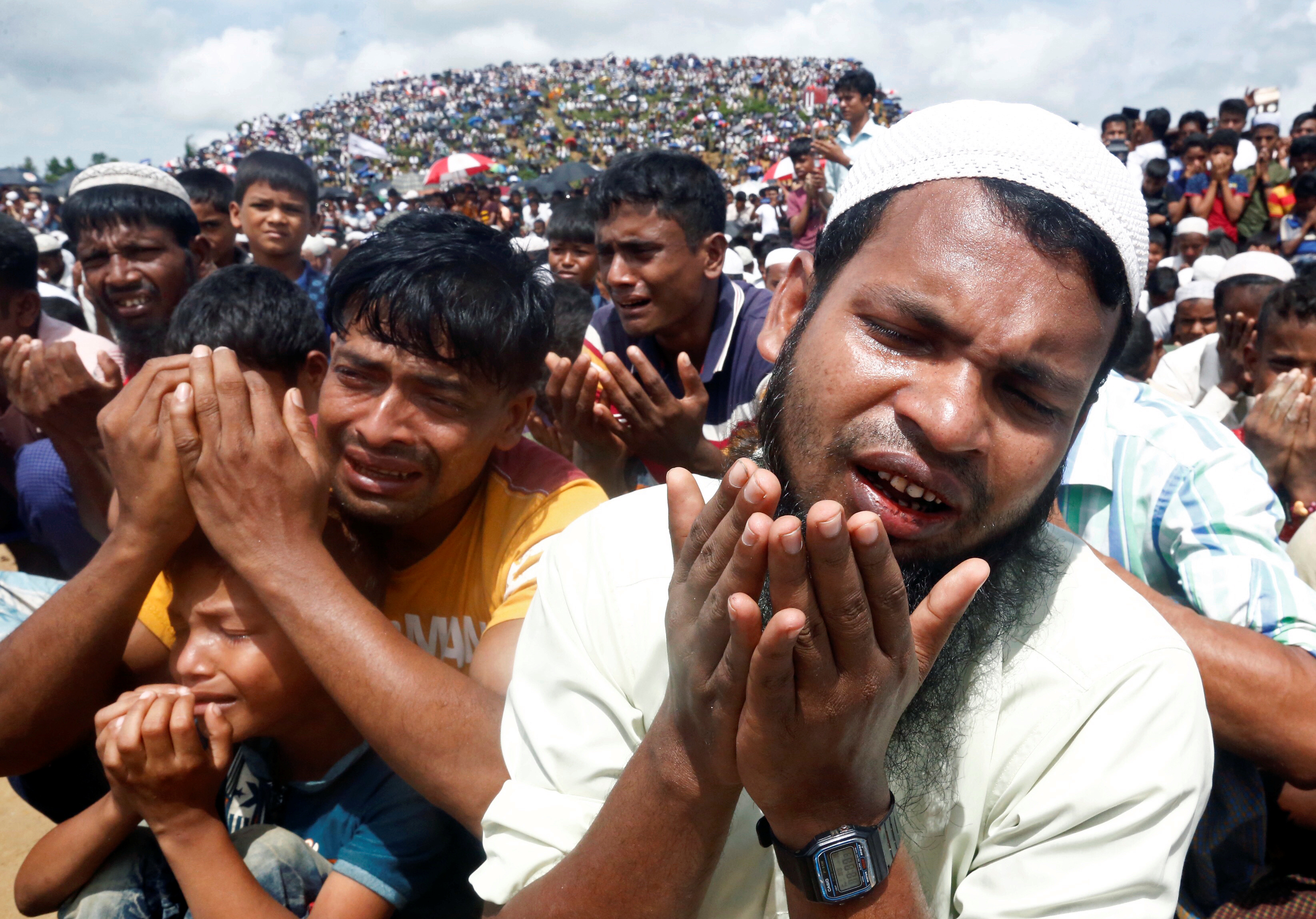 Rohingya refugees take part in a prayer as they gather to mark the second anniversary of the exodus at the Kutupalong camp in Cox’s Bazar, Bangladesh