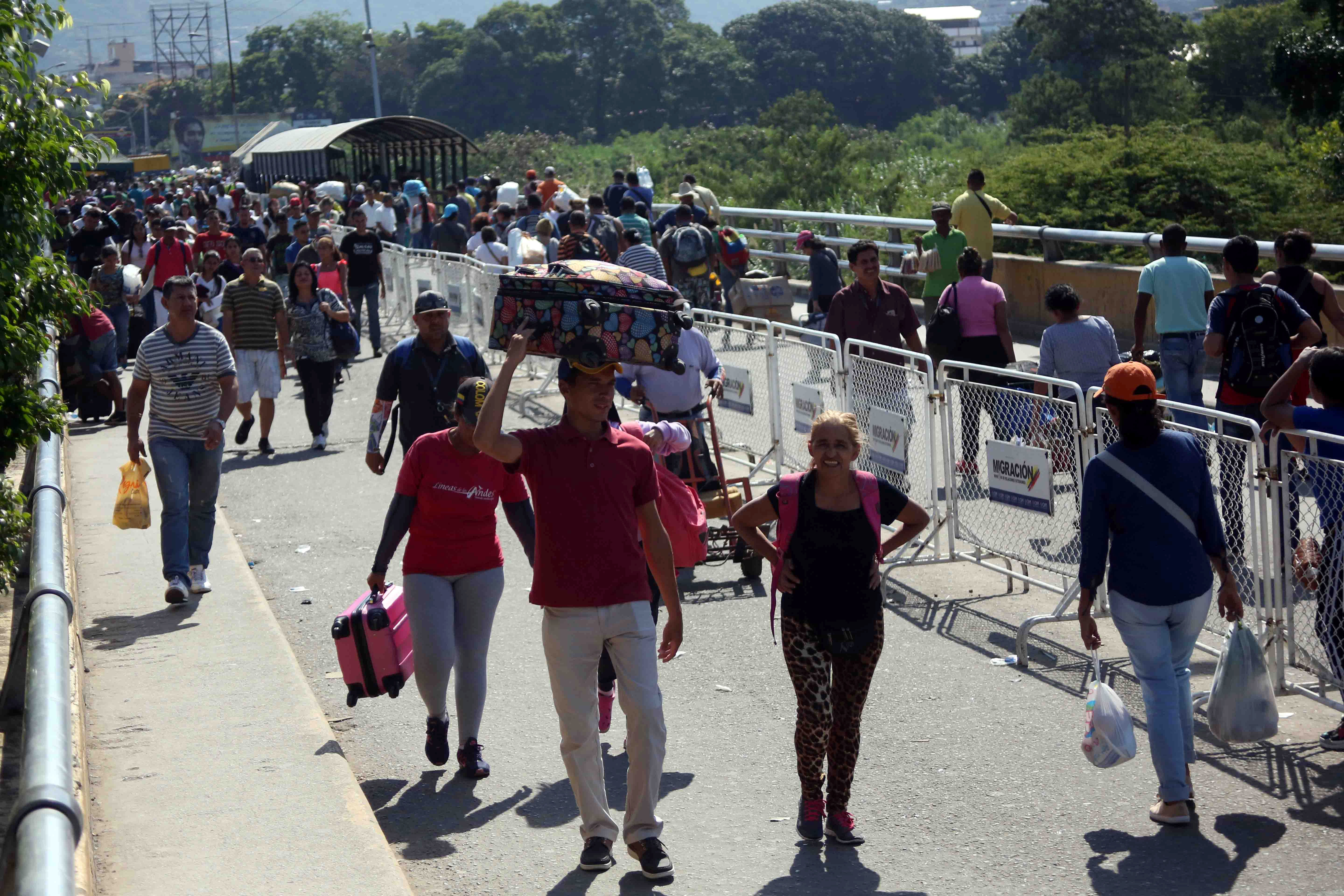 People walk crossing the Simon Bolivar bridge at the border with Venezuela in Cucuta, Colombia