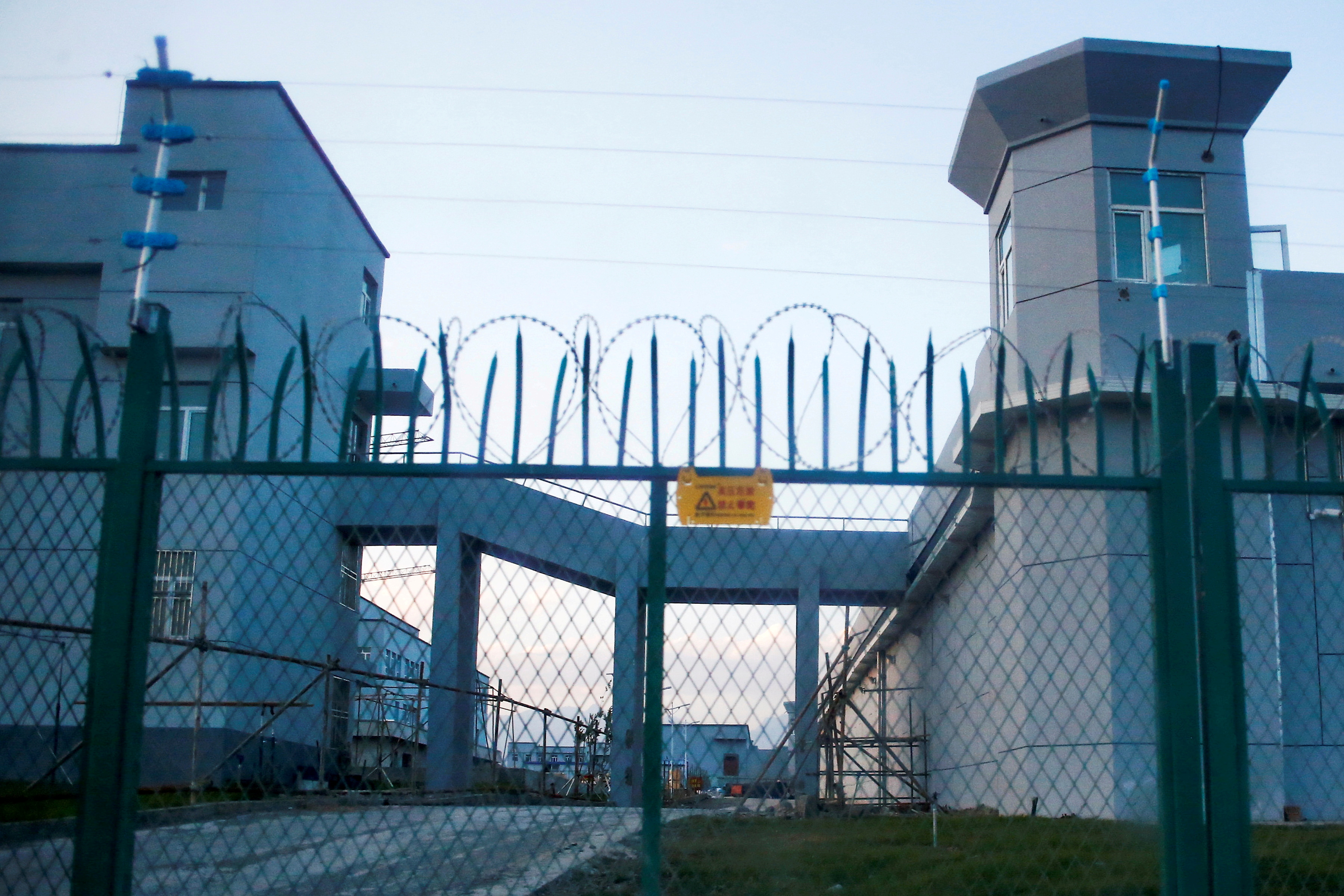 A perimeter fence is constructed around what is officially known as a vocational skills education centre