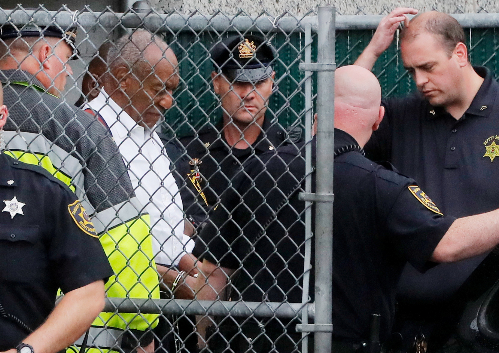 Actor and comedian Bill Cosby leaves the Montgomery County Court in handcuffs after sentencing in his sexual assault trial in Norristown, Pennsylvania on September 25, 2018