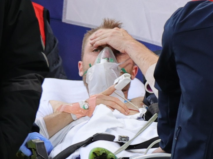 Eriksen is carried off the pitch
