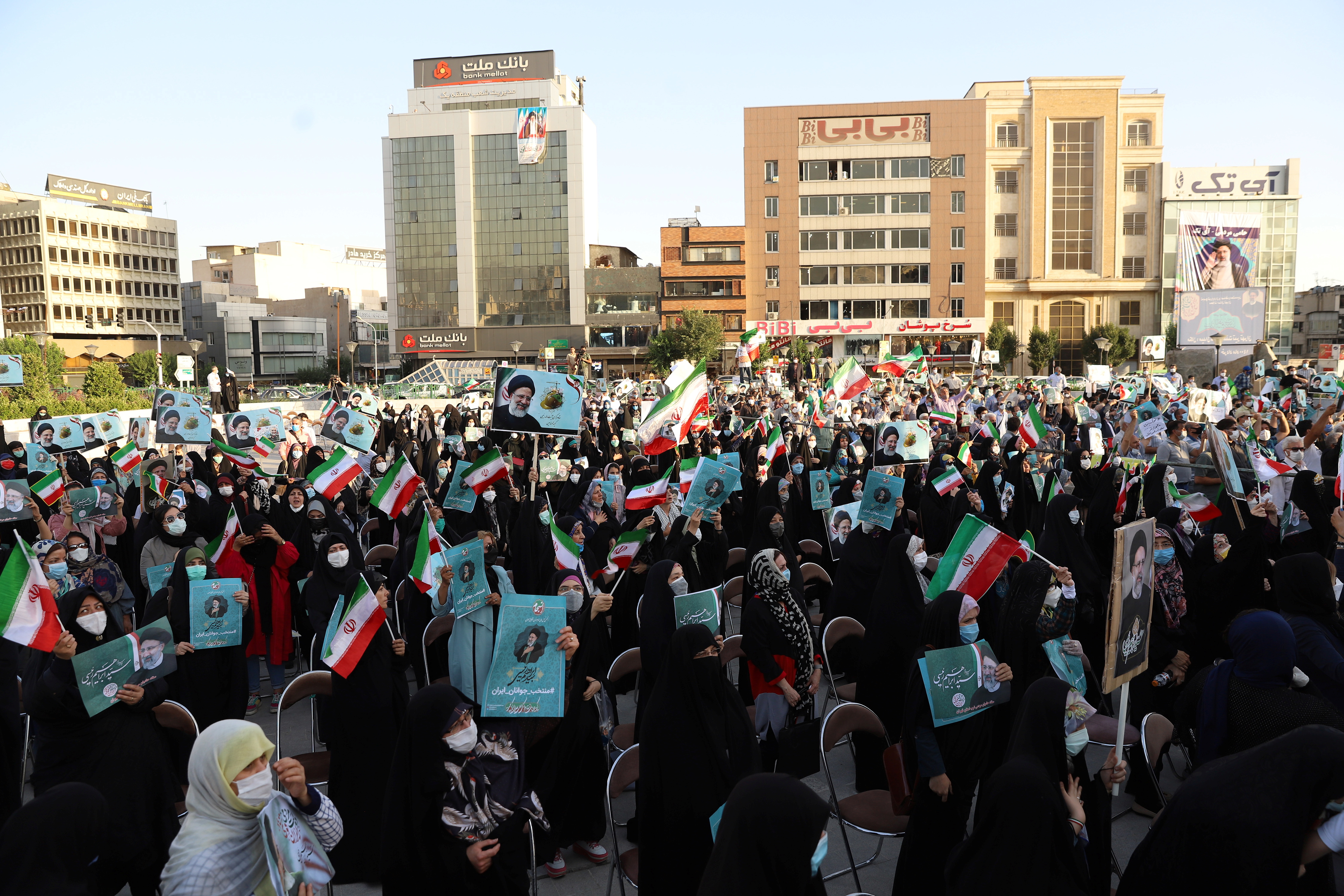 Supporters of presidential candidate Ebrahim Raisi attend an election rally in Tehran