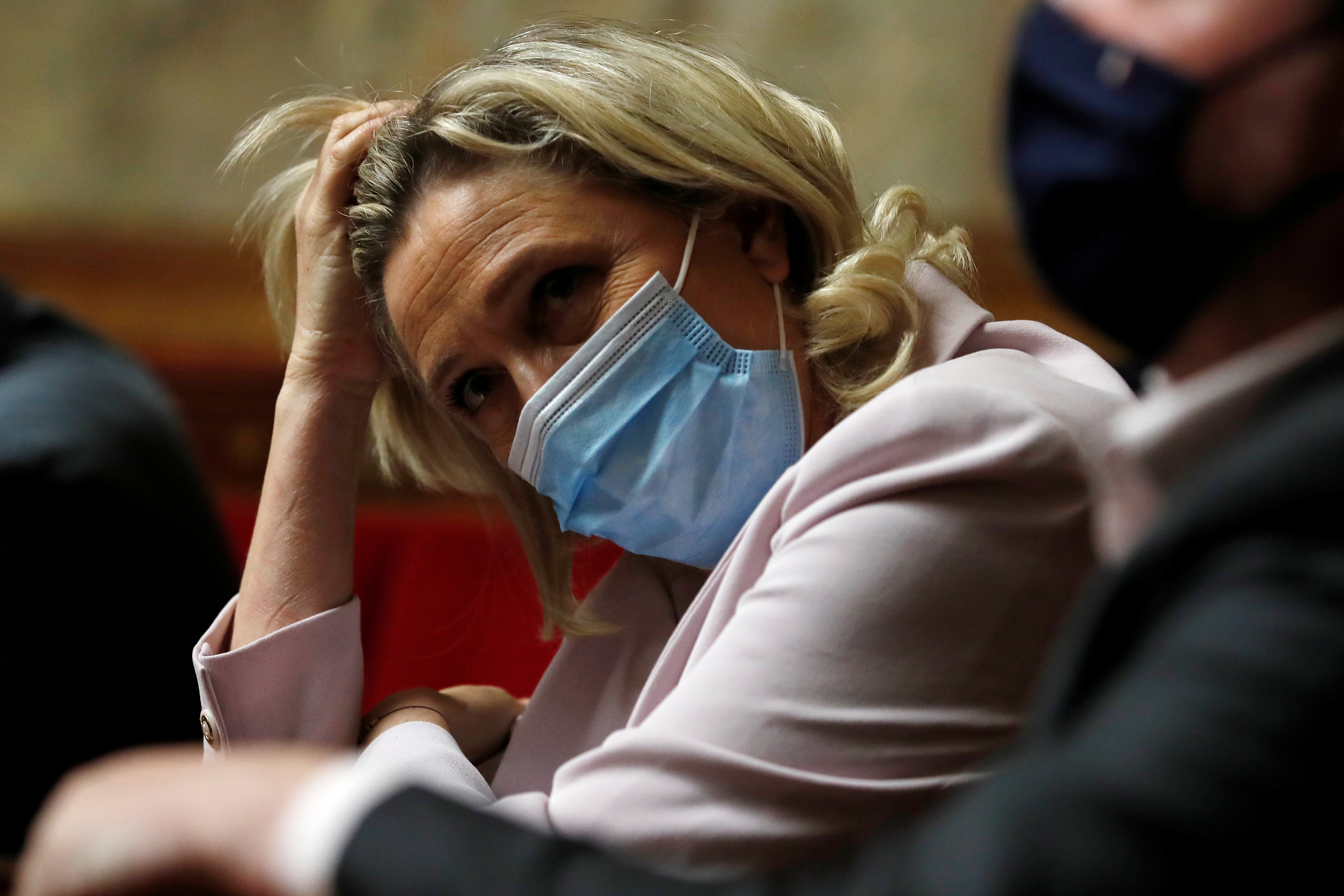 Marine Le Pen, a member of parliament and leader of the French far-right National Rally (Rassemblement National) party, wearing a protective face mask, attends the questions to the government session at the National Assembly in Paris, France, June 22, 2021 [Gonzalo Fuentes/Reuters]