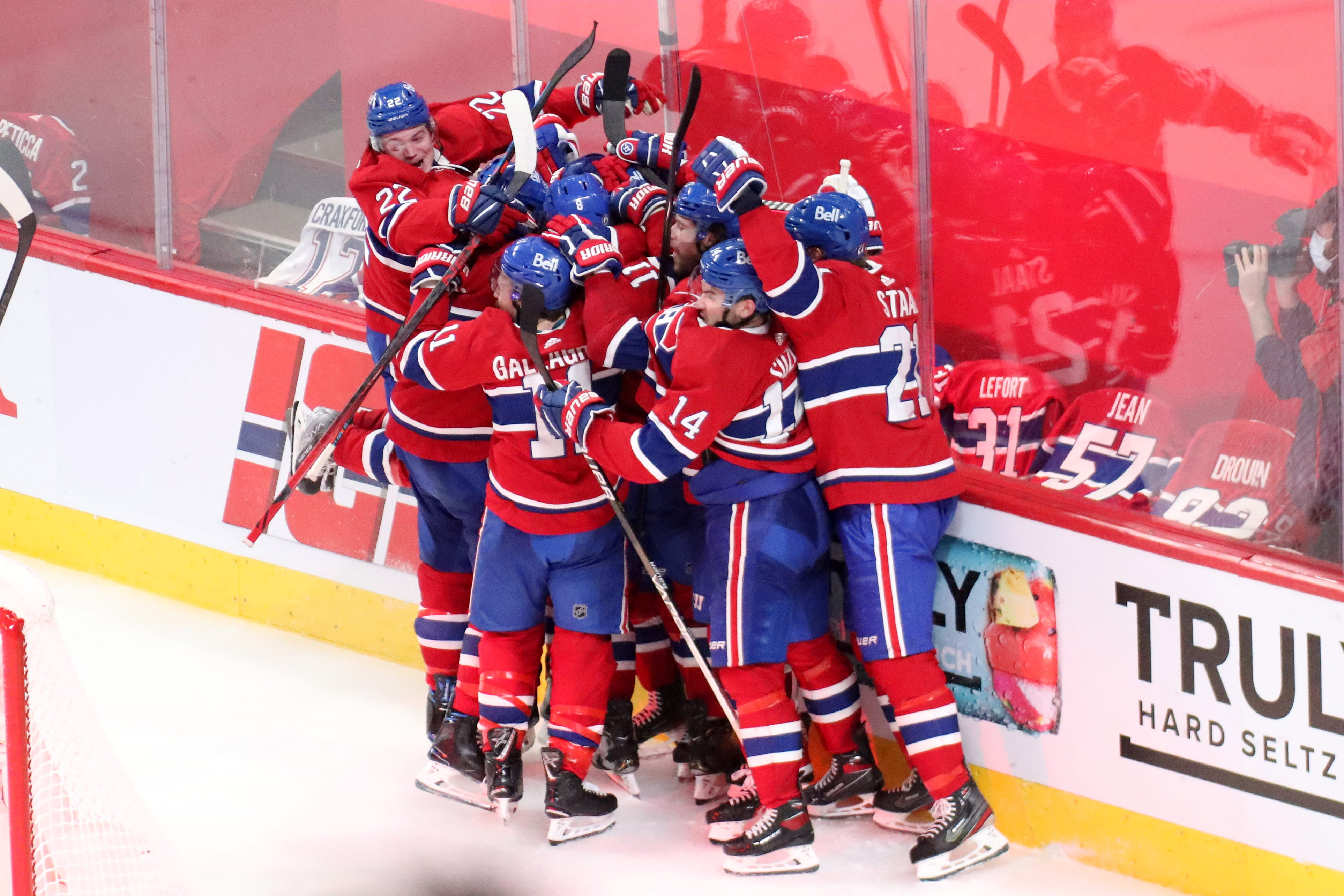 Montreal Canadiens players celebrate their win against the Vegas Golden Knights after an overtime goal