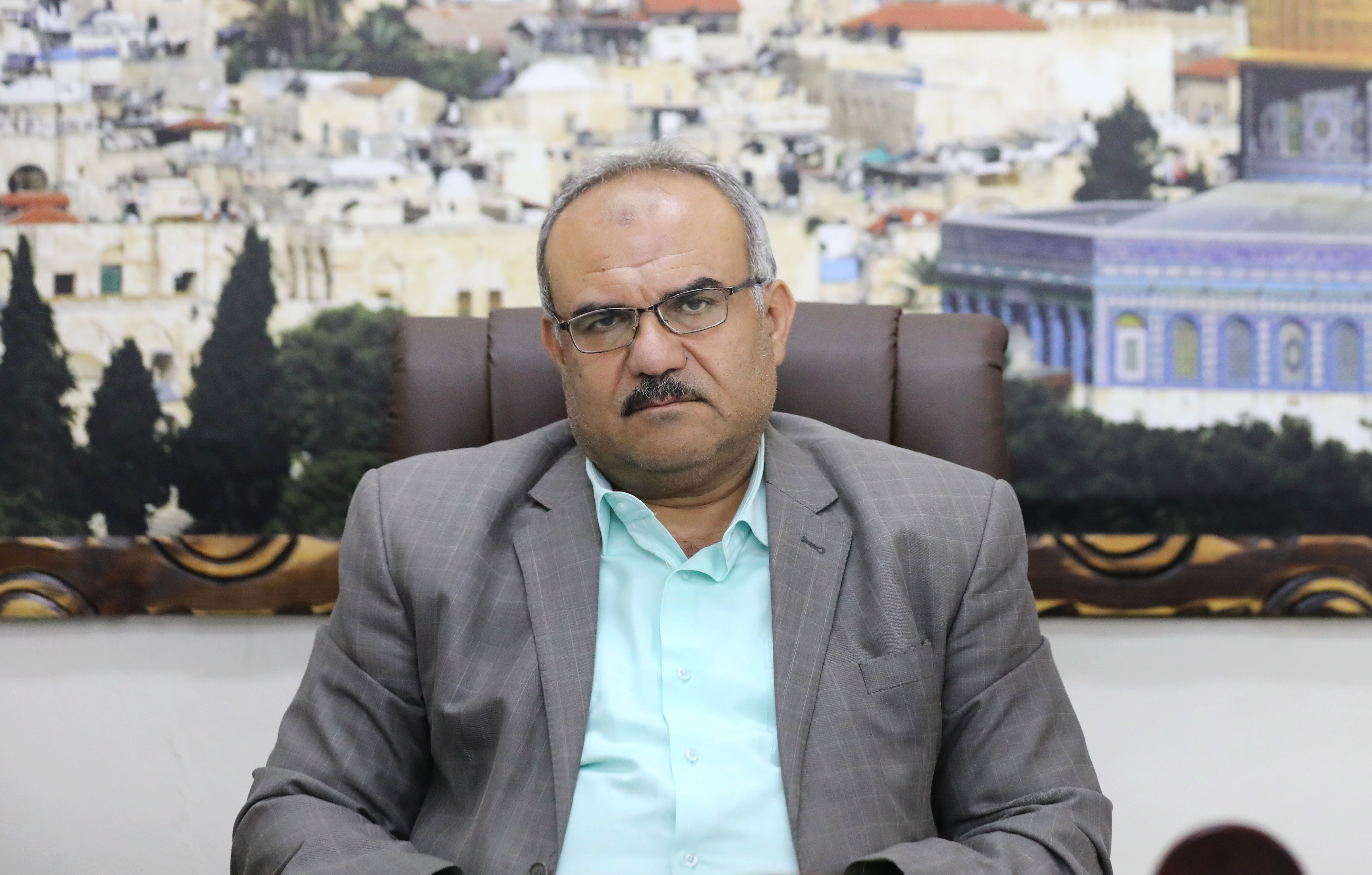 Under-secretary of Gaza’s ministry of public works and housing Naji Sarhan sits in his Gaza City office