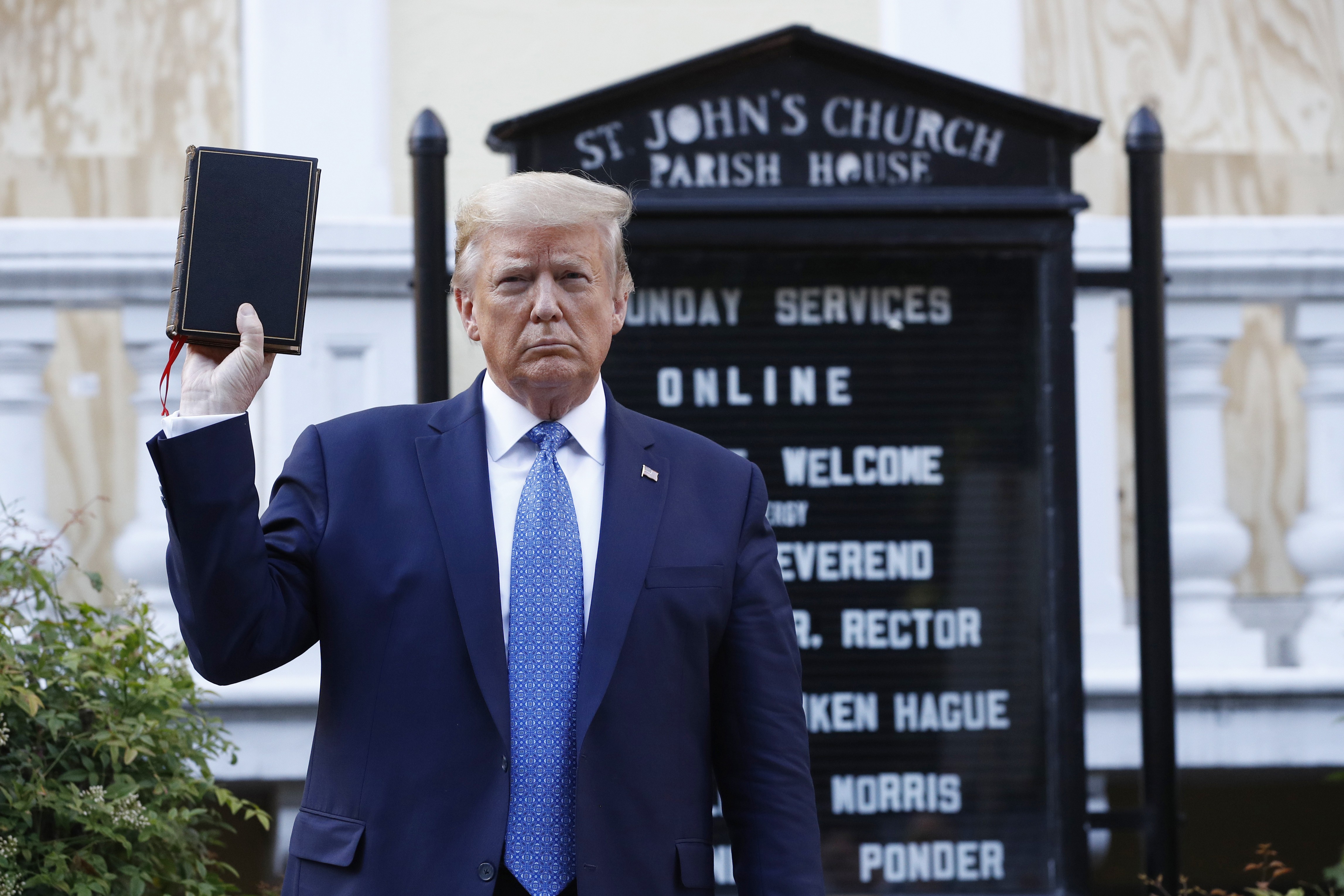 Former President Donald Trump holds a Bible as he visits outside St John’s Church across Lafayette Park from the White House in Washington, DC, on June 1, 2020