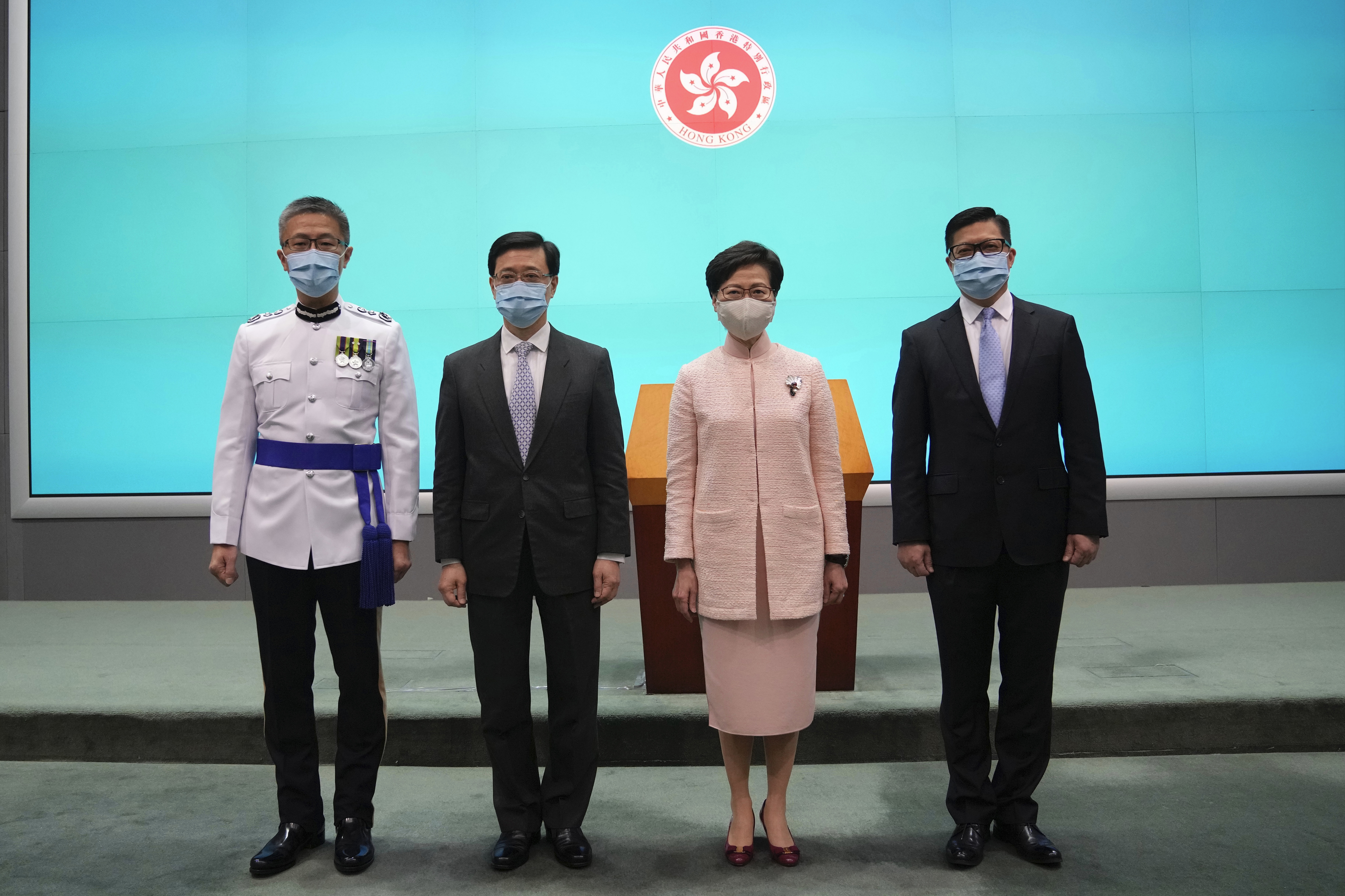 John Lee (second from left), standing next to Chief Executive Carrie Lam, was appointed Chief Secretary on June 25 last year after a life spent focused on security