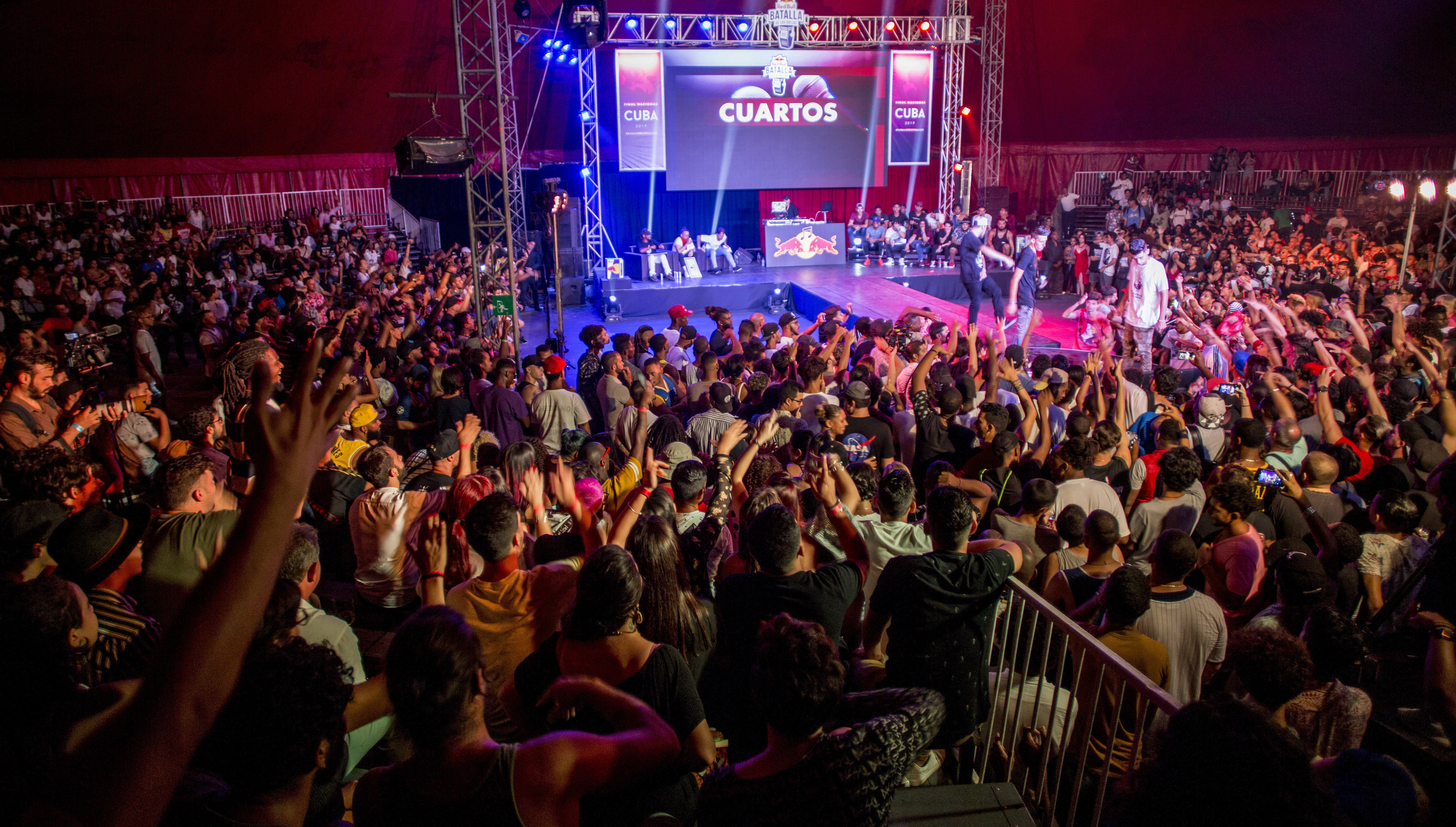 A crowd fills the Circo Trompo Loco circus tent during the final battle of Los Gallos del Rap 2019, in Havana, Cuba