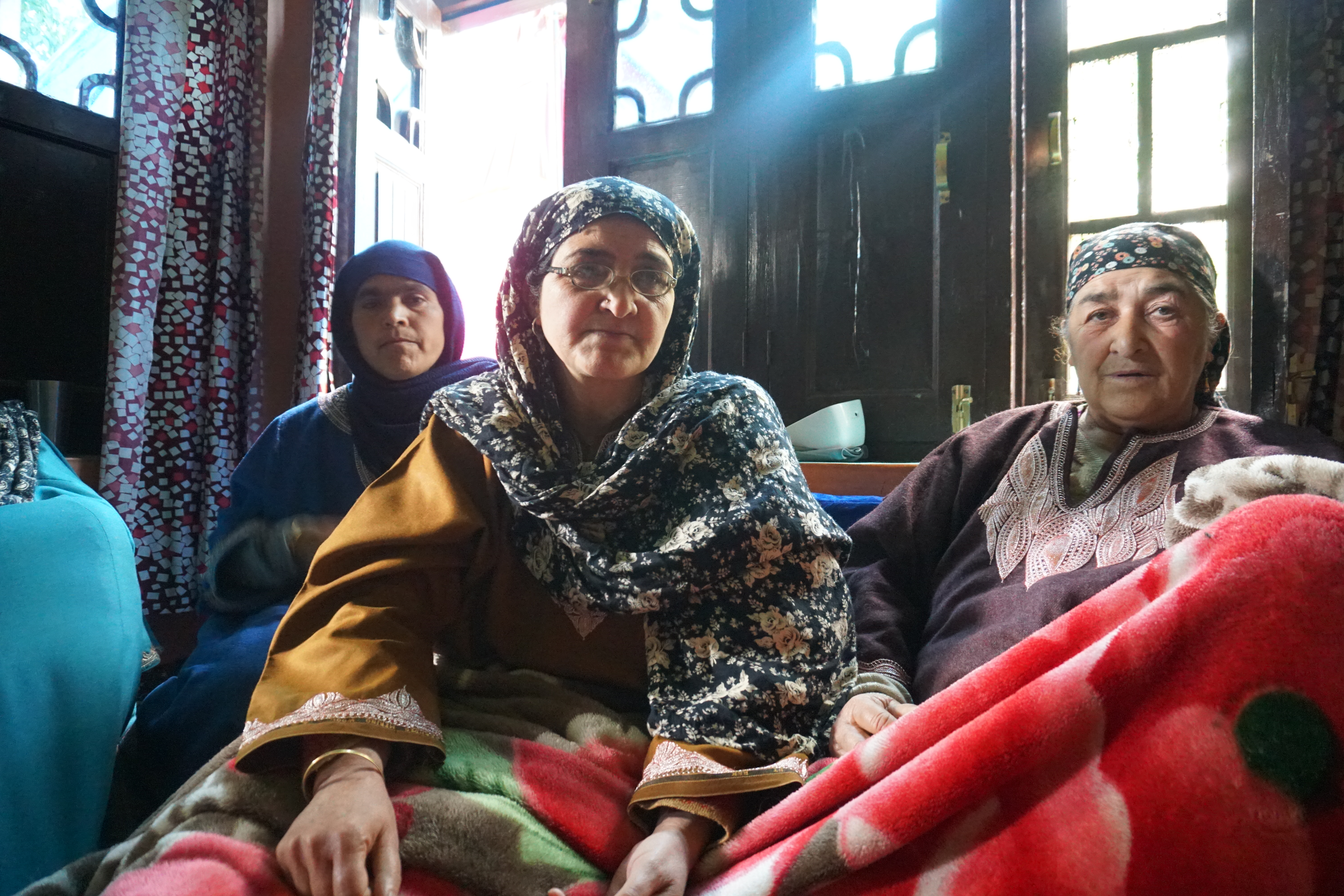 Jameela Bashir, centre, mourning the death of her son at her home in Avil village in Kulgam, Indian-administered Kashmir