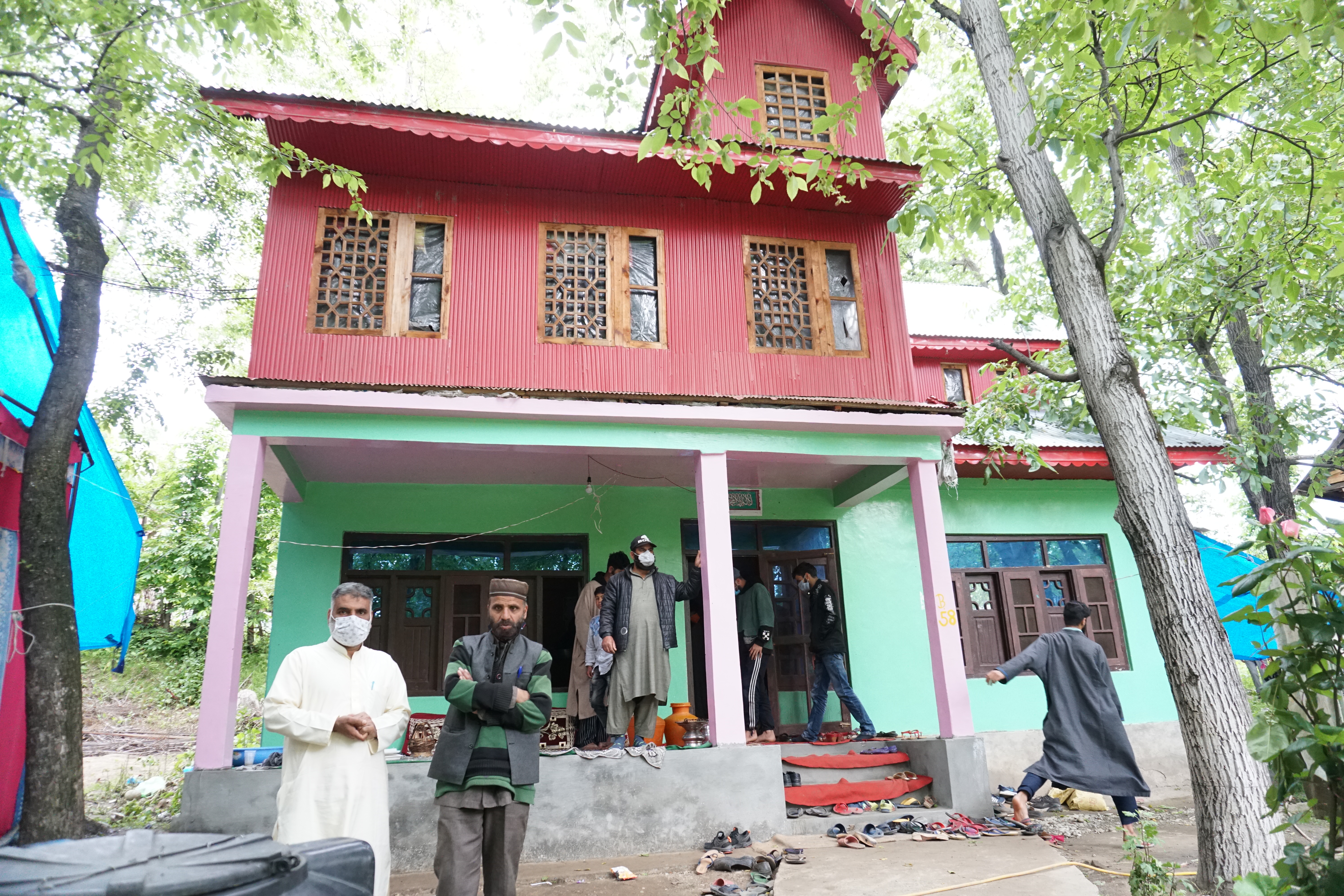 Mourners arriving at the house of Shoaib Bashir Mir in Kulgam