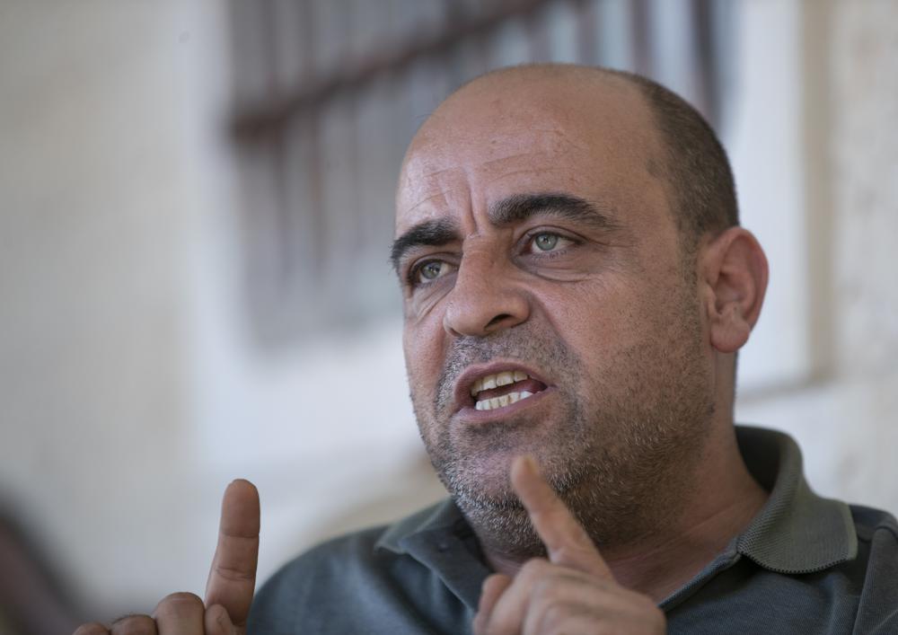 Nizar Banat, an outspoken critic of the Palestinian Authority, speaks to journalists in the West Bank city of Hebron on May 4, 2021