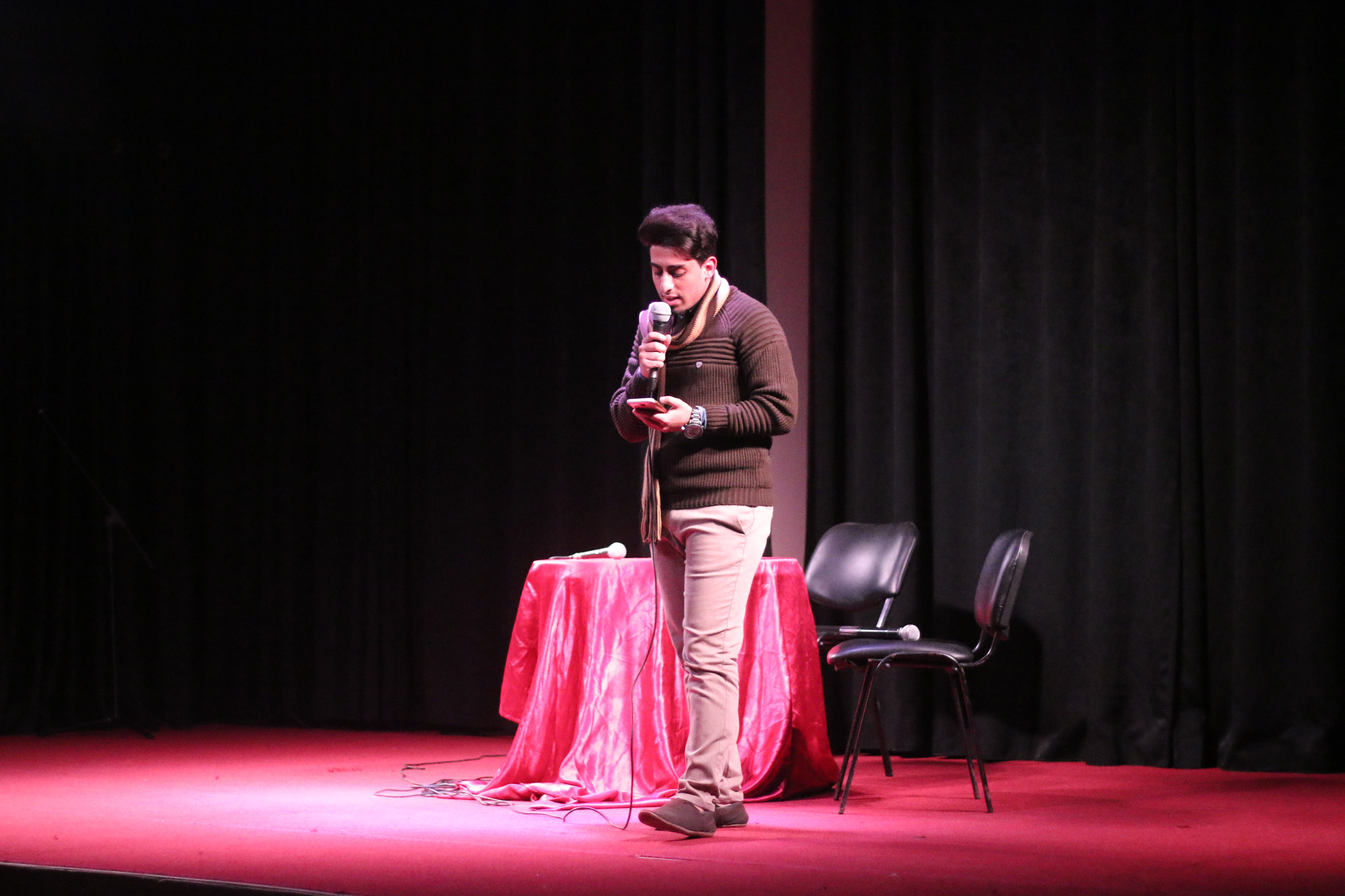 A poet performs at the Hymns of Peace spoken word event in November 2018 [Photo courtesy of Mohammed Moussa]