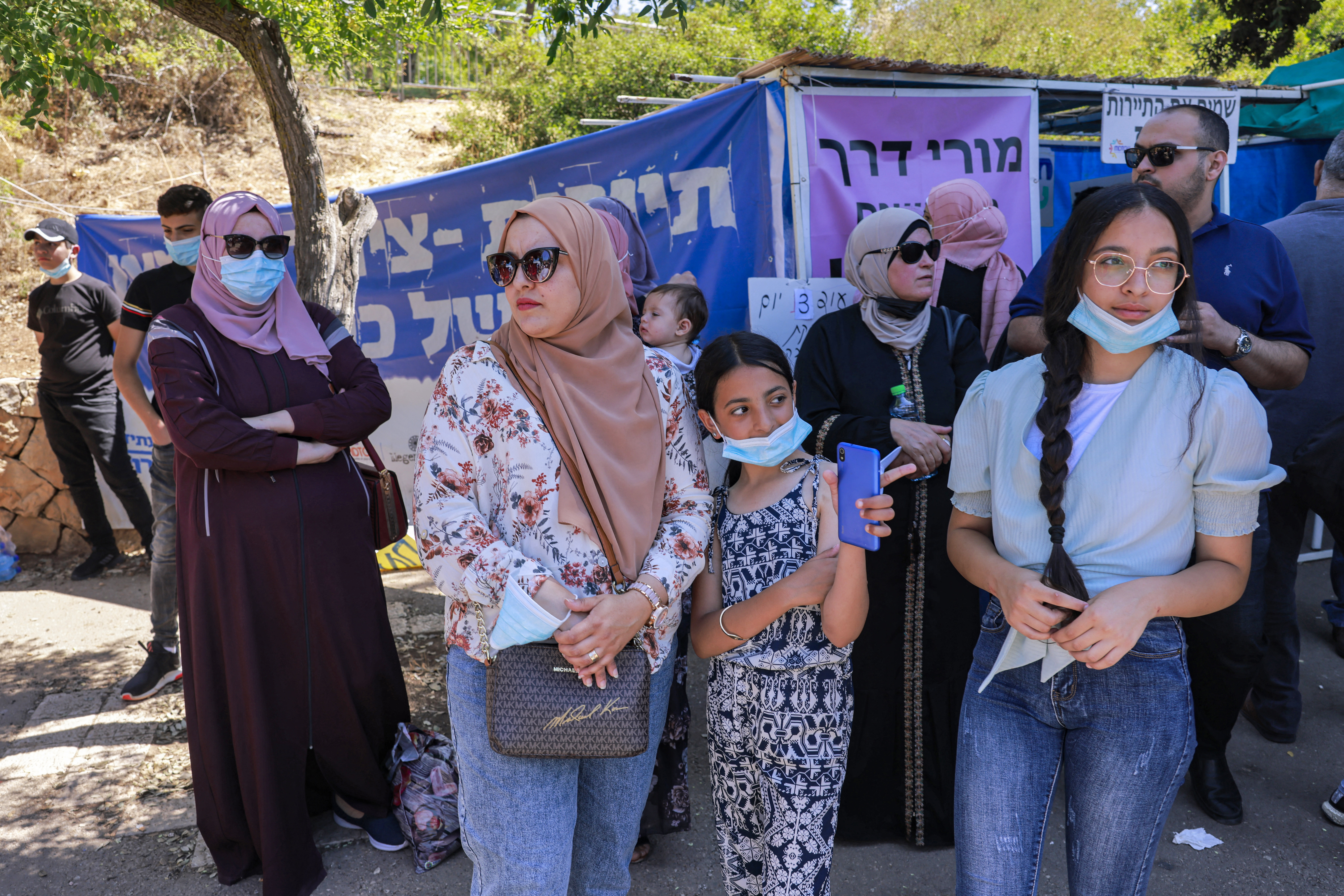 Demonstrators gather to protest outside the Israeli Knesset headquarters against the Israeli citizenship law on June 29, 2021.
