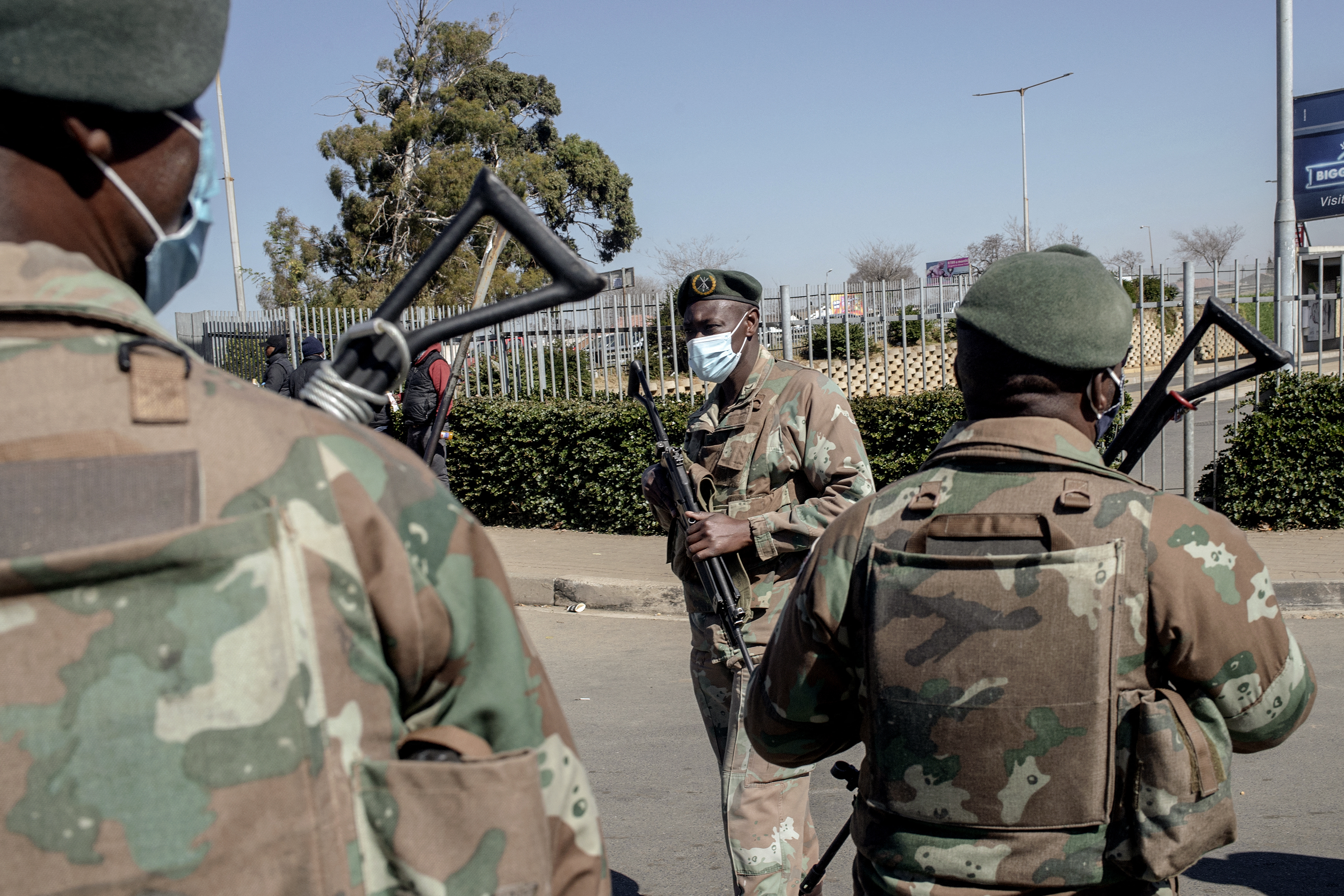 Soldiers stand guard in front of Maponya Mall in Soweto