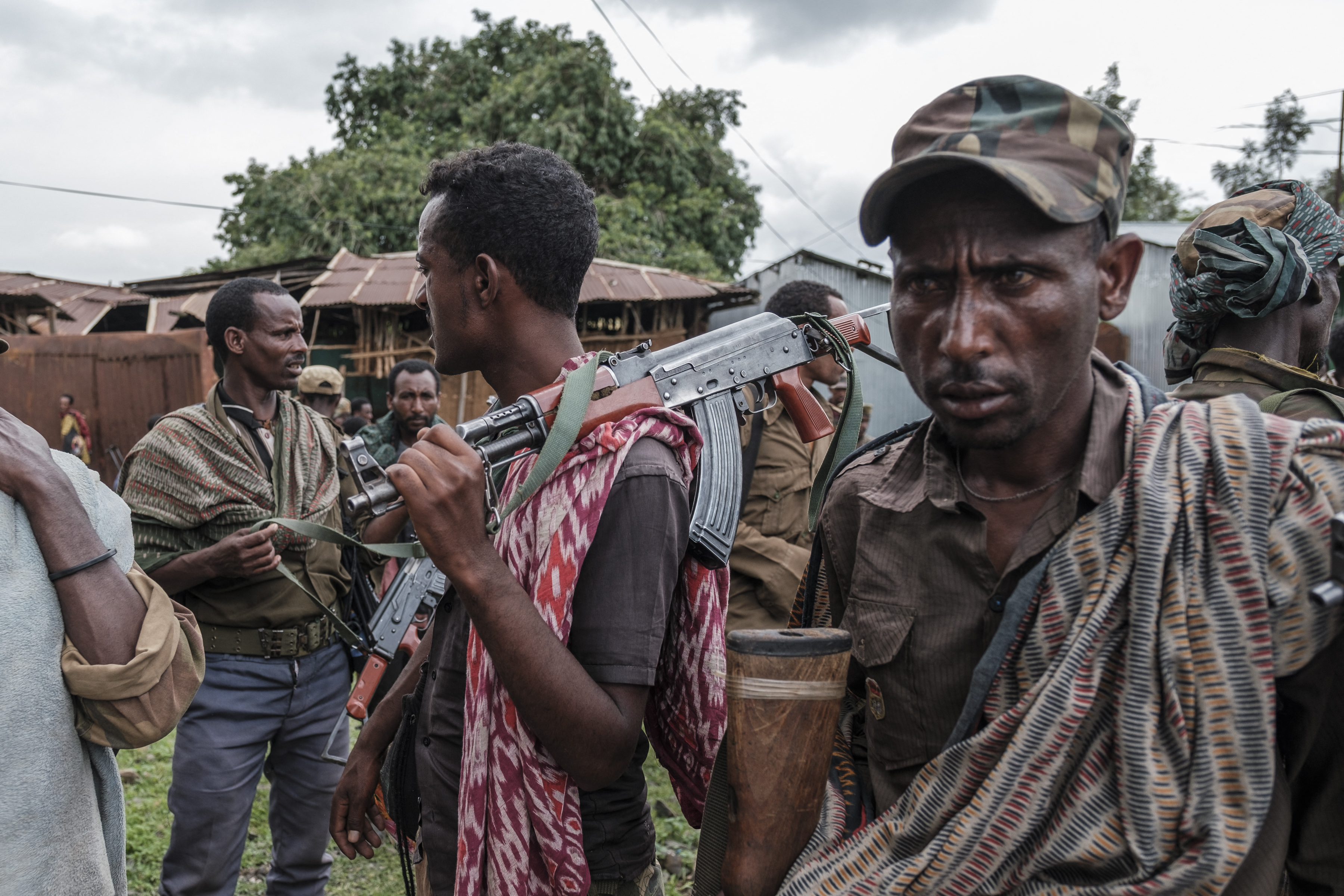 Members of the Amhara militia gather in the village of Adi Arkay, 180 kilometers northeast from the city of Gondar, Ethiopia, on July 14, 2021. - On Wednesday the Amhara government spokesman Gizachew Muluneh announced that regional special forces and militias would shift to "attack" mode to reverse the recent battlefield gains by the Tigrayan rebels. His statement appeared just hours after Prime Minister Abiy Ahmed, winner of the 2019 Nobel Peace Prize, vowed to "repel" attacks by Ethiopias enemies. (Photo by EDUARDO SOTERAS / AFP) (AFP)