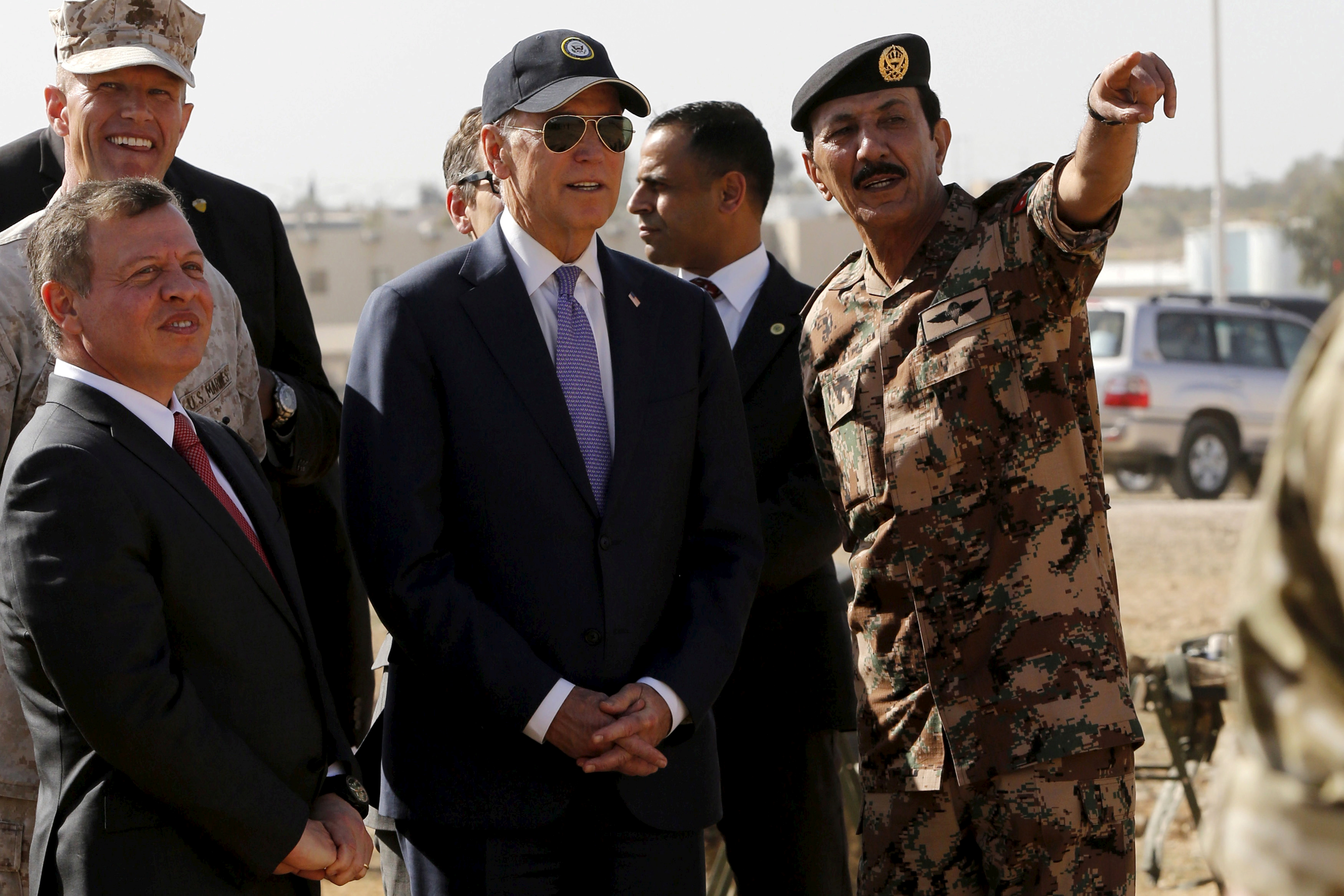 King Abdullah and Vice President Biden listen to Jordanian General Mashal Mohammad Zaben during their visit to a joint Jordanian-American training centre at Zarqa in 2016