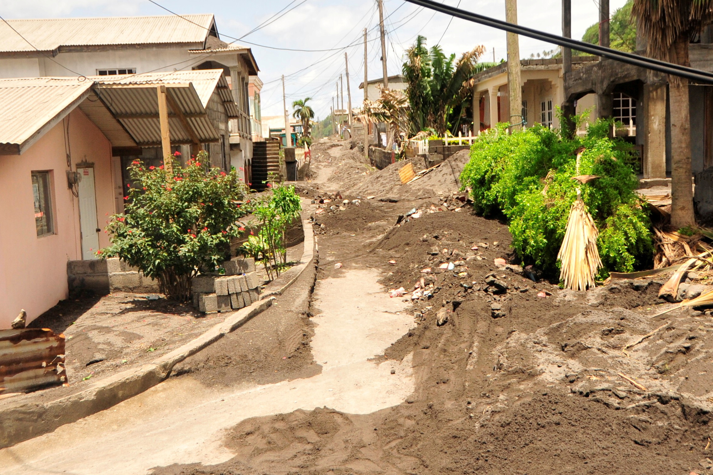 Volcanic ash and mud fill a road following the passing of Elsa in an area on the north coast of Sandy Bay, Saint Vincent and the Grenadines, on July 3