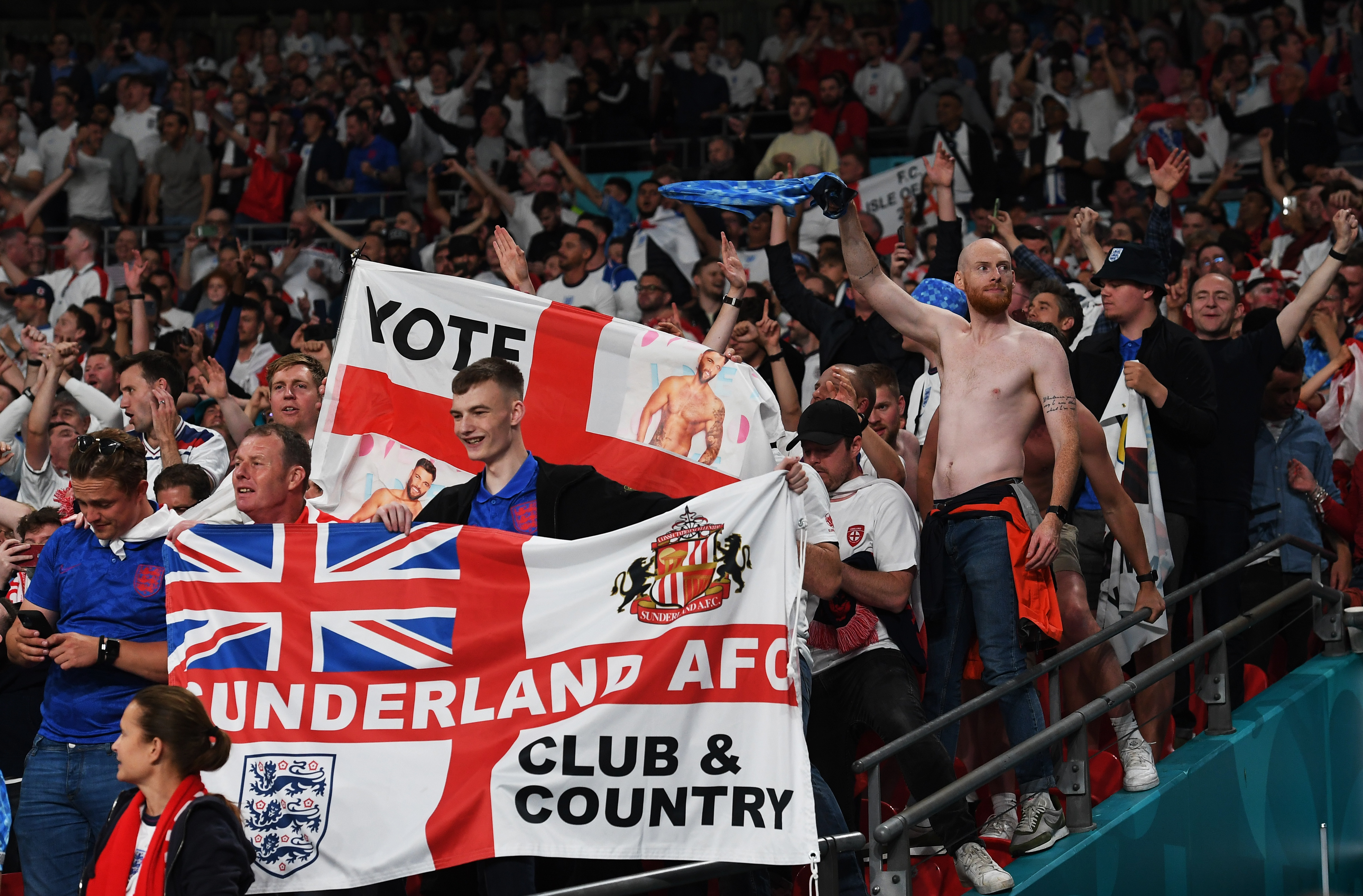 England fans celebrate after their team’s victory against Denmark [Pool via Reuters]