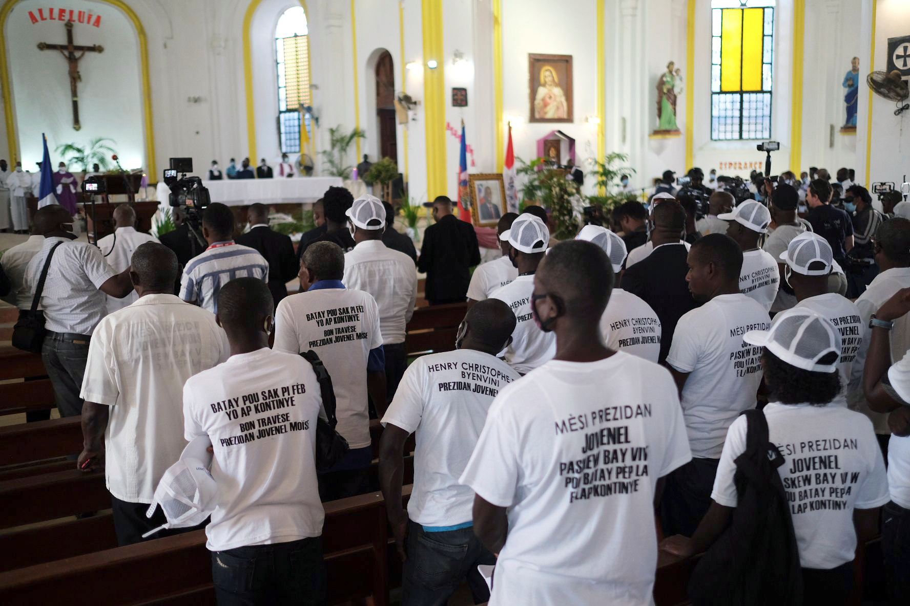 Haitians attend the wake of slain Haitian President Jovenel Moise at Notre Dame Cathedral in Cap-Haitien, Haiti