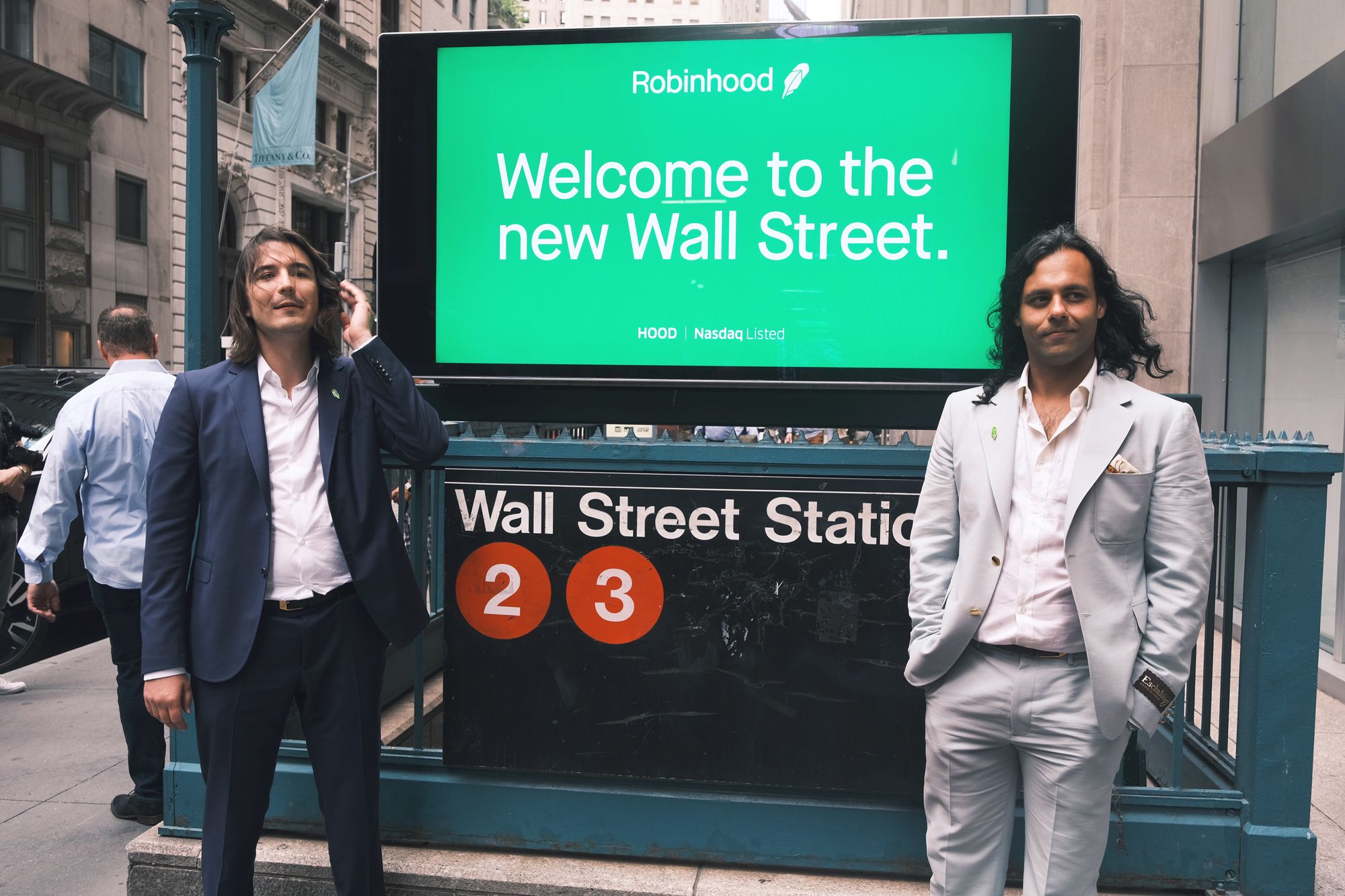 Vlad Tenev (left) and Baiju Bhatt (right), founders of the online brokerage Robinhood, walk along Wall Street Thursday after their firm’s lacklustre stock market debut