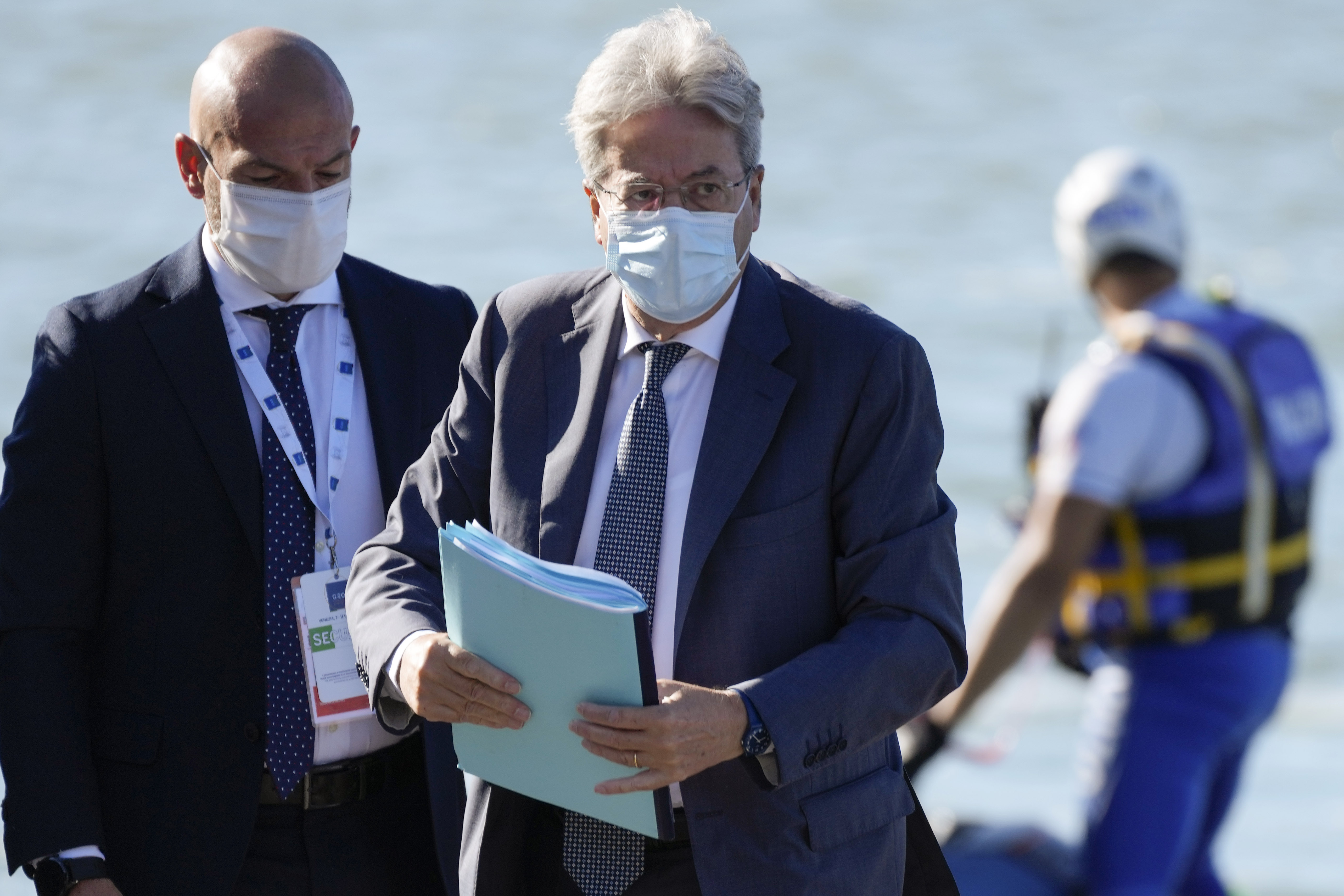 EU Commissioner for Economy Paolo Gentiloni, centre, arrives for a G20 meeting of economy and finance ministers and central bank governors, in Venice, Italy