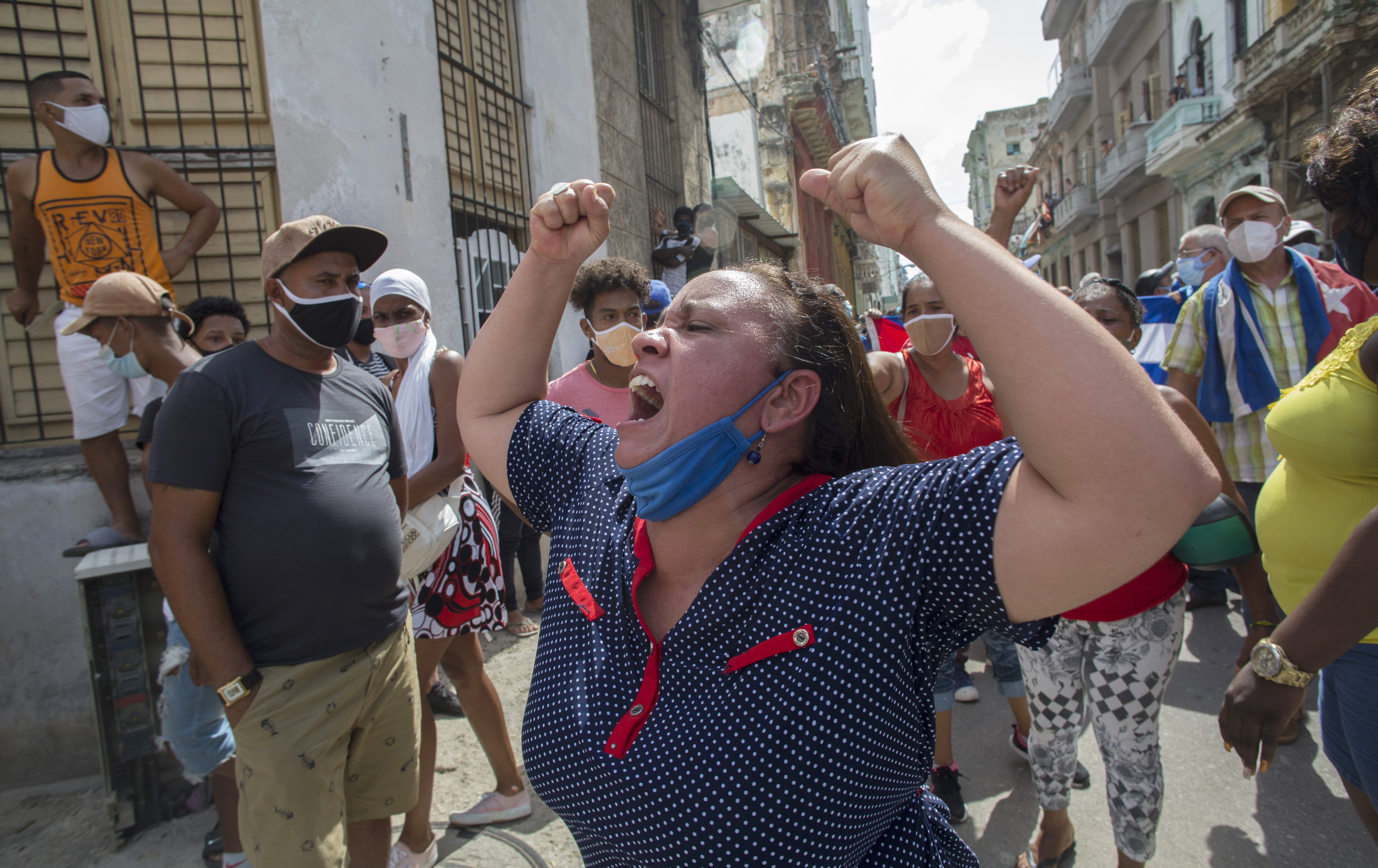 A woman shouts pro-government slogans as anti-government protesters march in Havana, Cuba on July 11, 2021