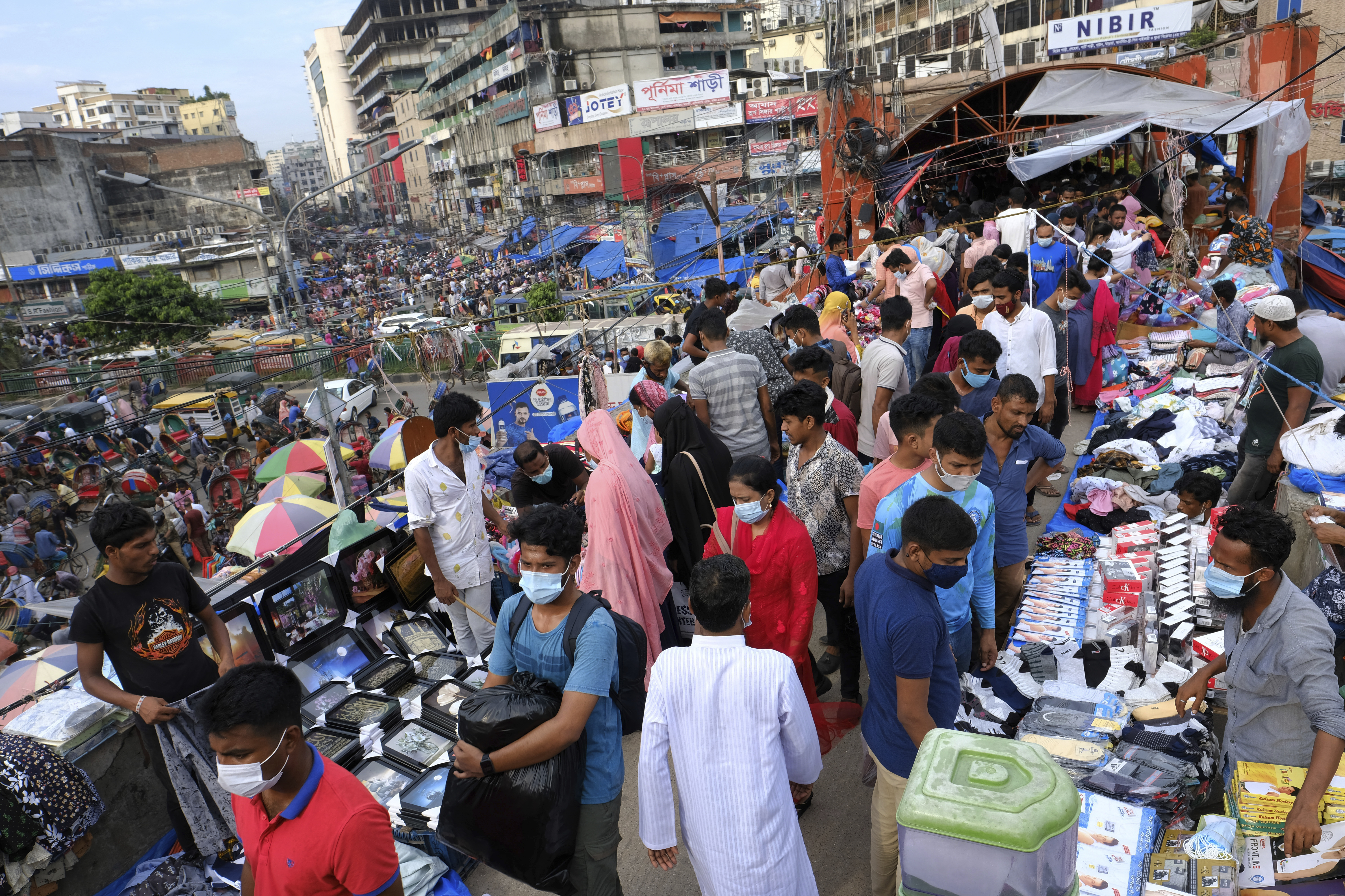 Millions of Bangladeshis are shopping and travelling during a controversial eight-day pause in the lockdown