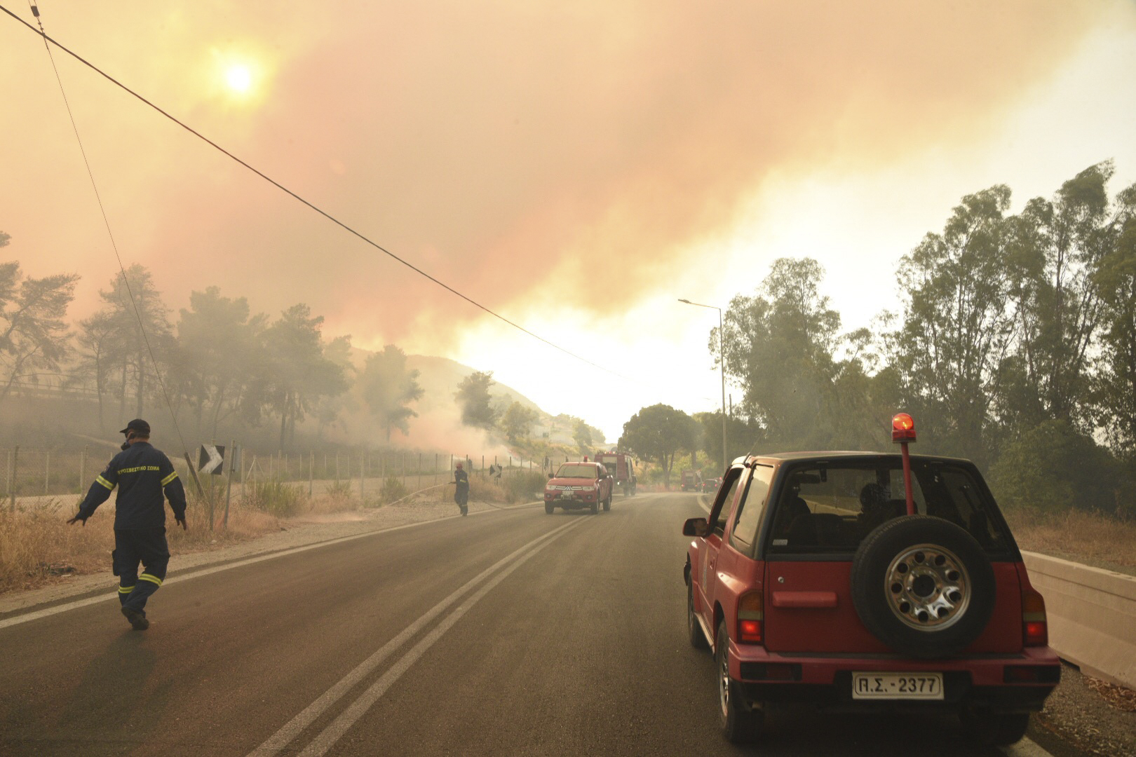 The wildfire near Lampiri village, west of Patras, started high up on a mountain slope but has moved dangerously close to seaside towns