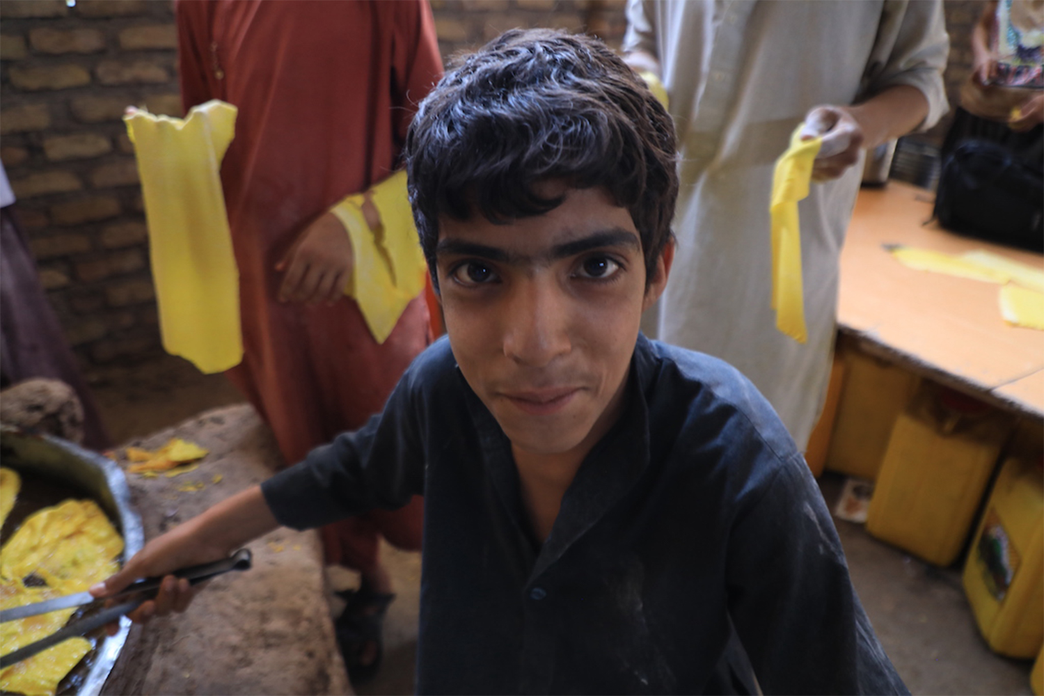 With increased demand over Eid holidays, sweet makers and tailors often turn to young boys for extra help in fulfilling orders