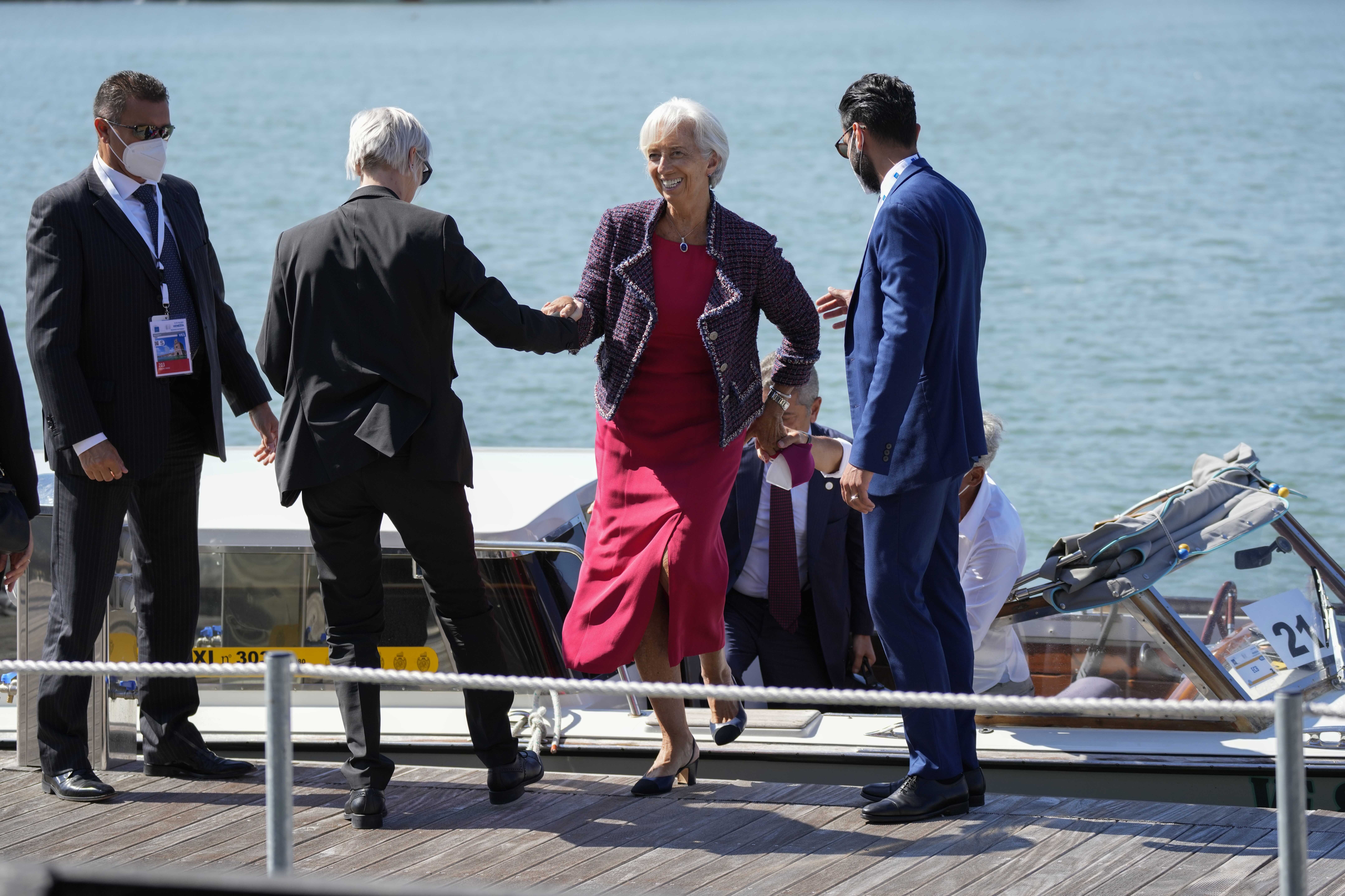 European Central Bank President Christine Lagarde, second from right, arrives for a G20 meeting of economy and finance ministers and central bank governors, in Venice, Italy