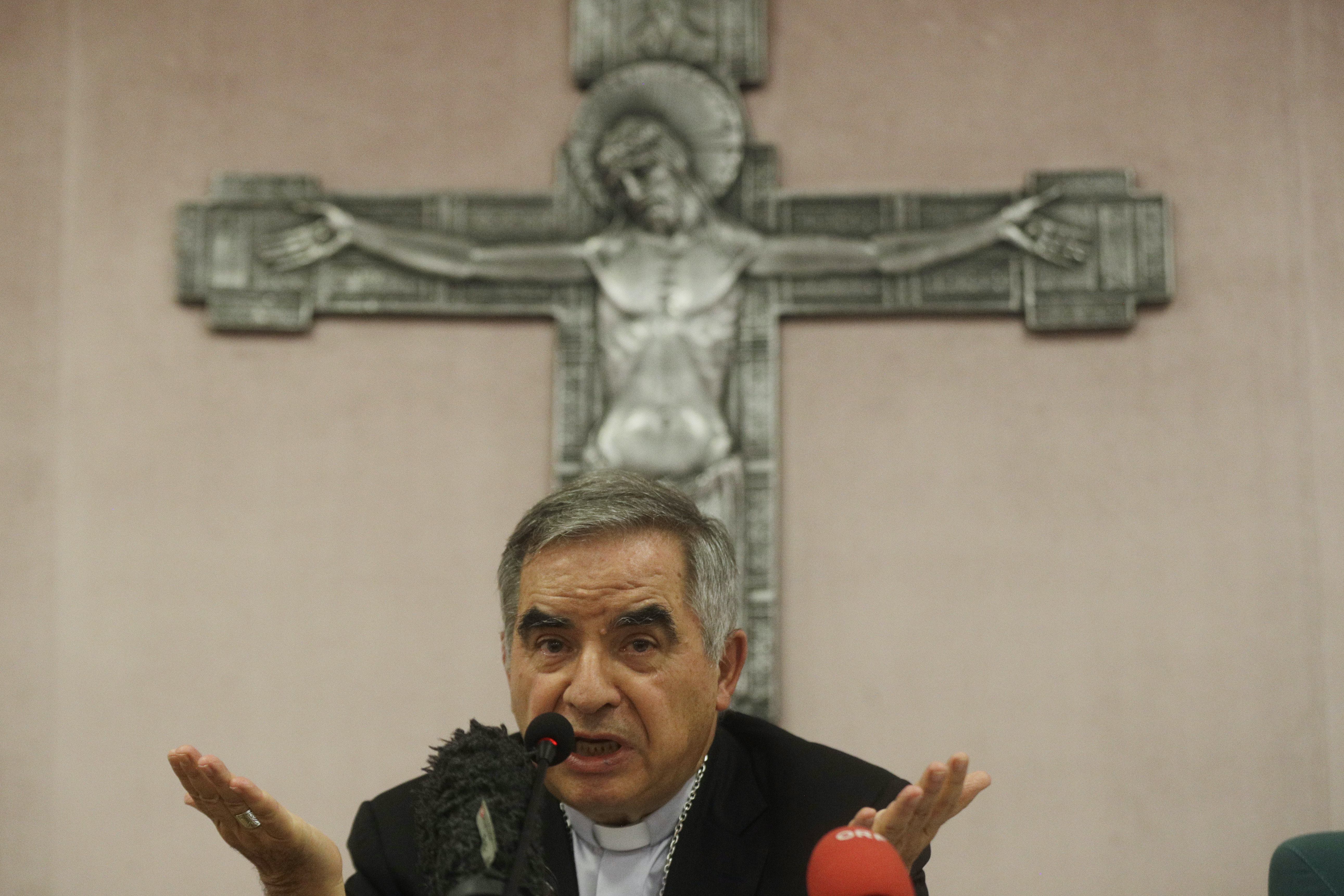 Cardinal Angelo Becciu talks to journalists during a press conference in Rome