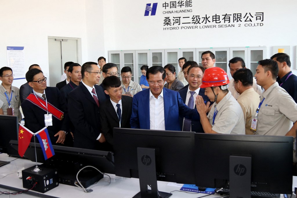 Cambodia’s Prime Minister Hun Sen (C) inaugurates the 400 megawatt Lower Sesan 2 hydropower plant during a ceremony in Stung Treng province in December 2018
