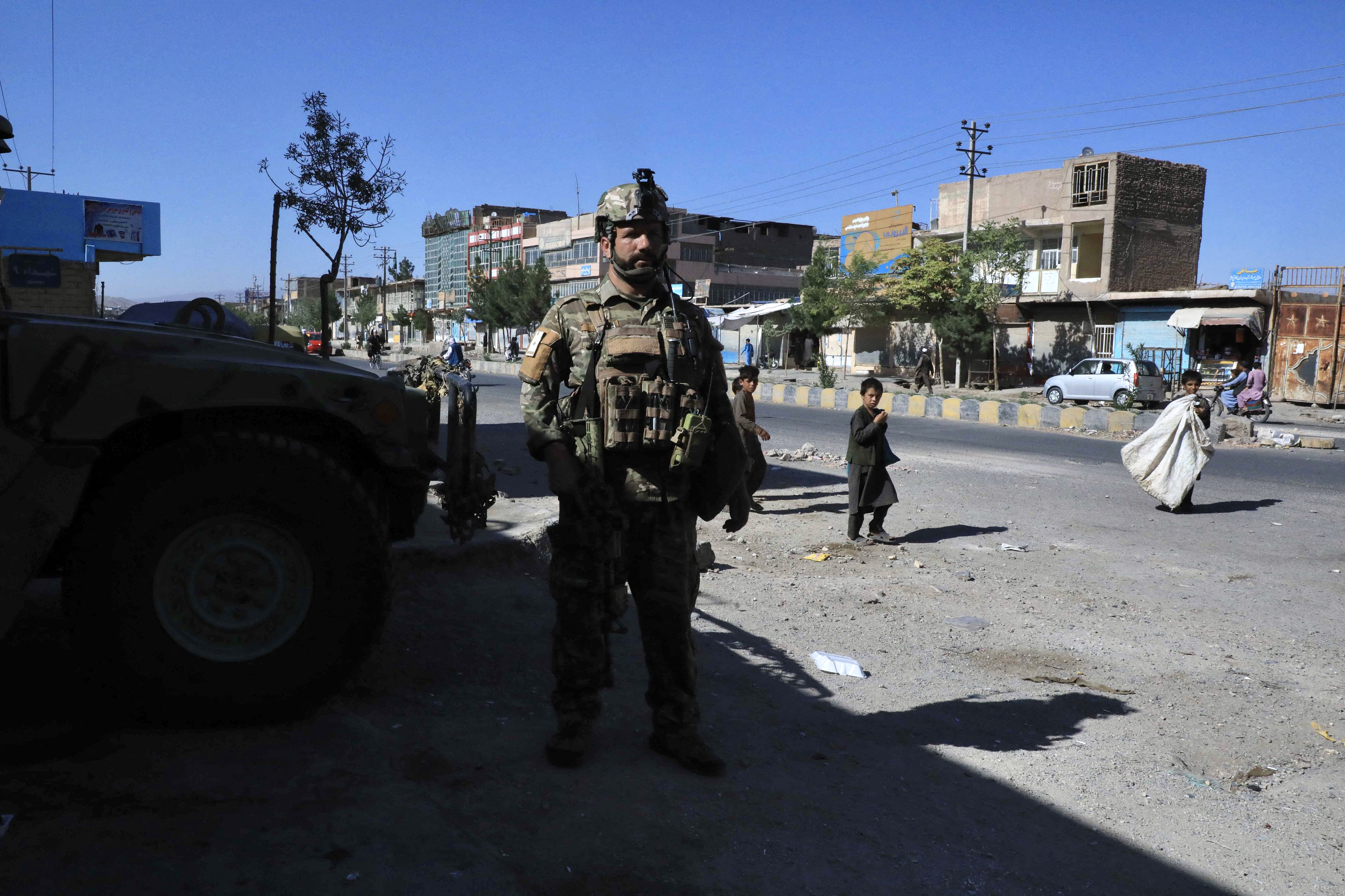 An Afghan security force personnel stands guard along the roadside in Herat on August 12, 2021 [AFP]