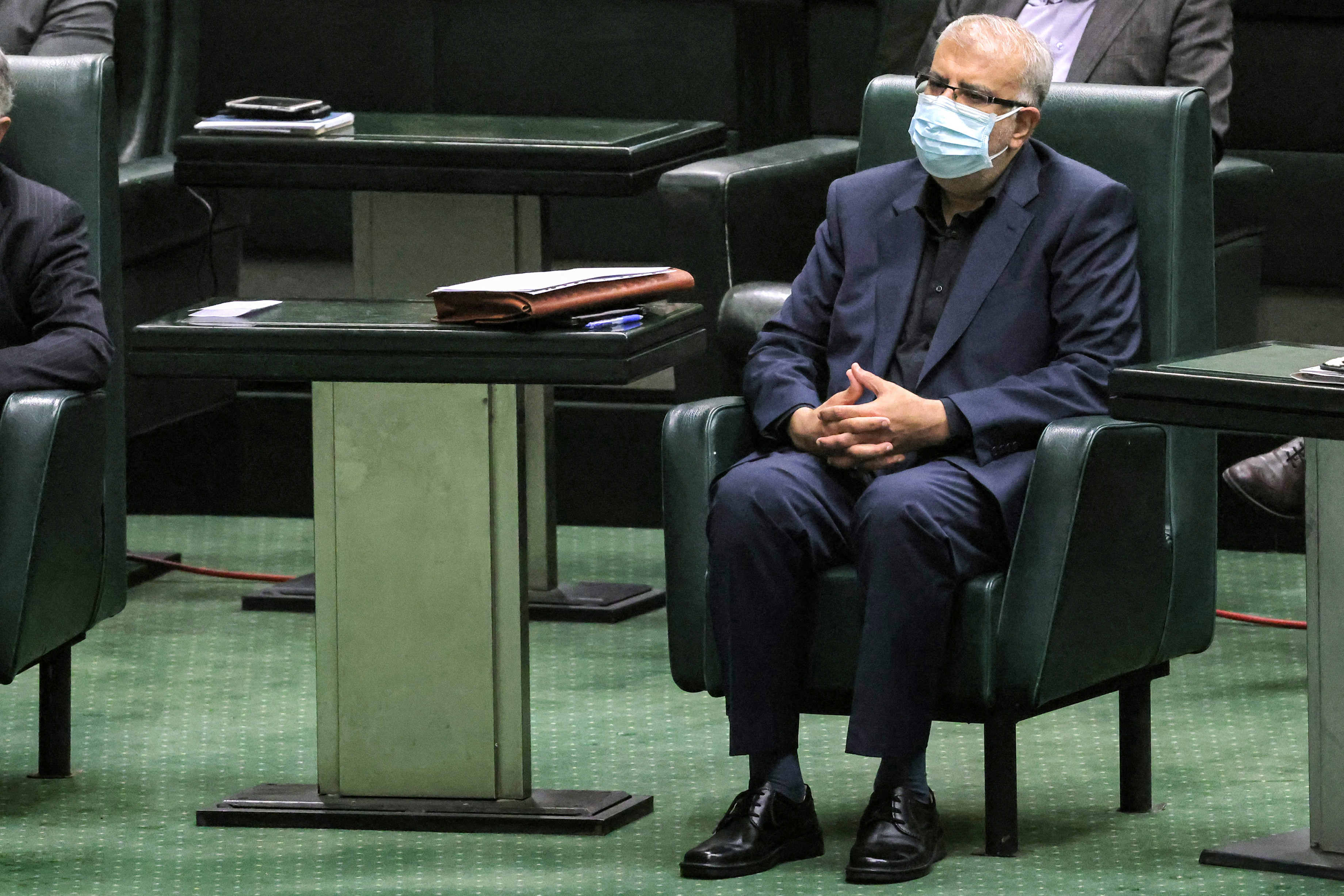 Javad Oji, the new candidate for oil minister, looks on during a parliament session to review the new president’s cabinet selection in the capital Tehran on August 21, 2021