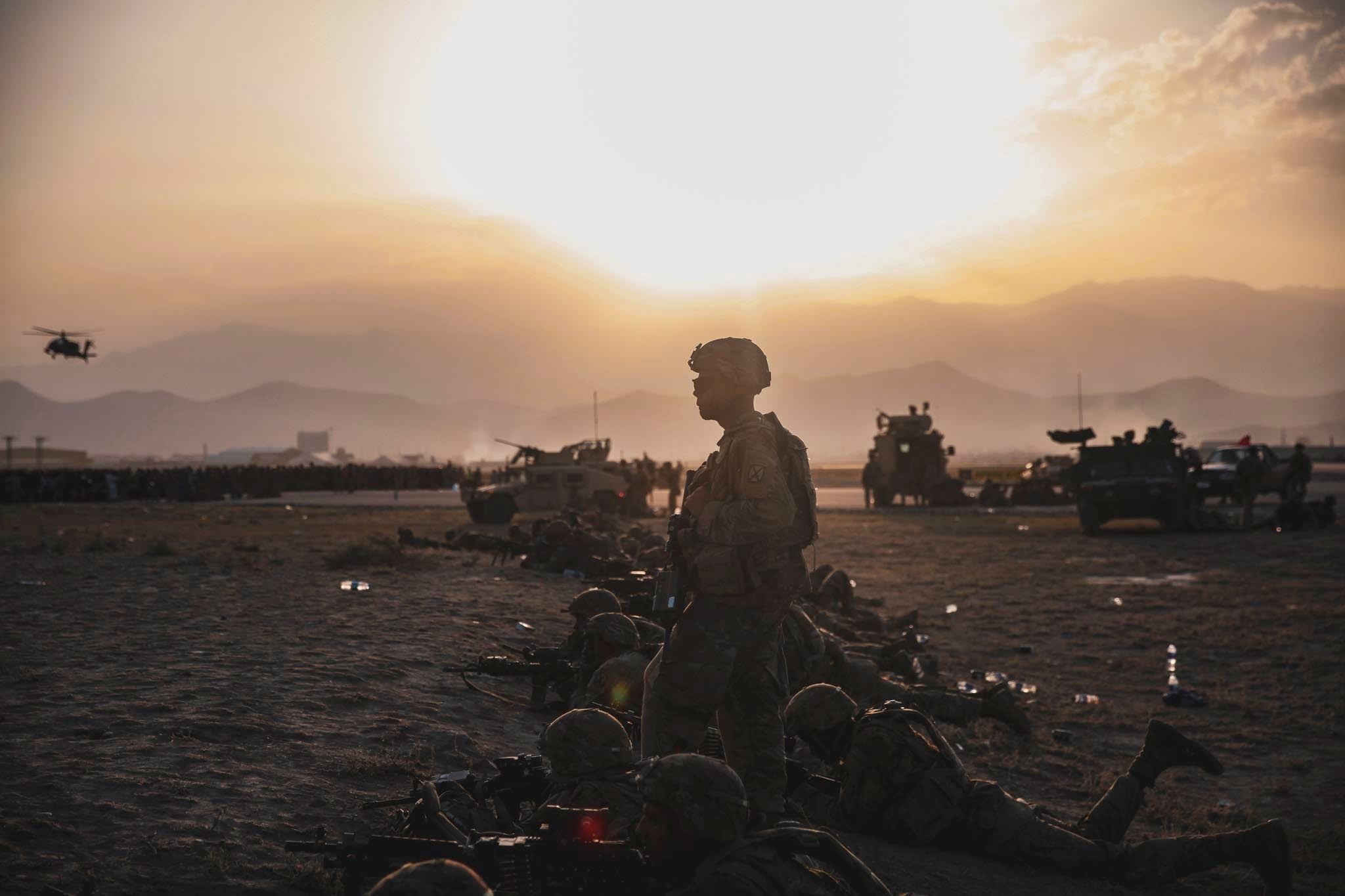 United States Army soldiers assigned to the 10th Mountain Division stand security at Hamid Karzai International Airport in Kabul, Afghanistan, in this photo taken on August 15, 2021 [Sgt Isaiah Campbel/Central Command Public Affairs/l/Handout via Reuters]