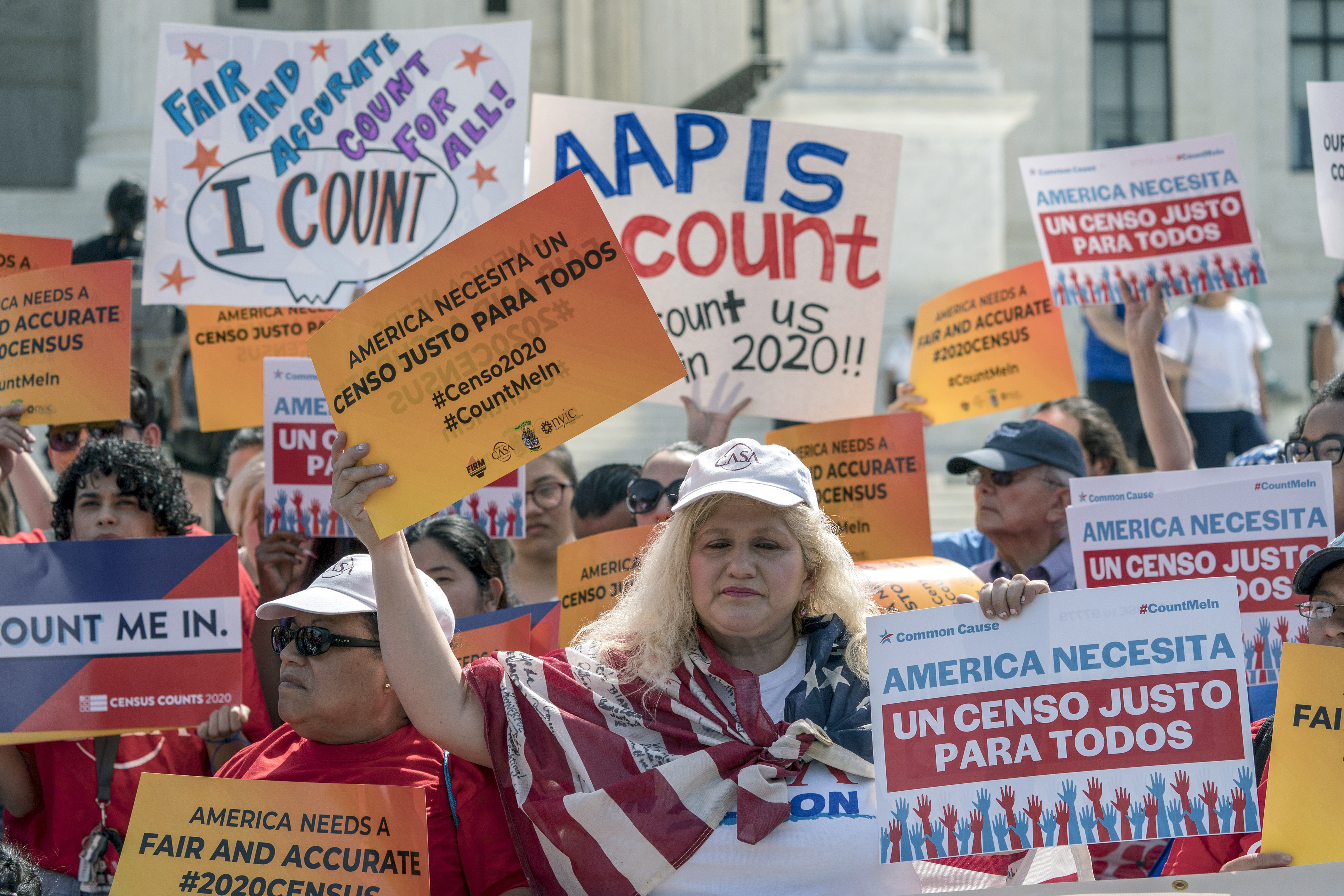 Immigration activists rally outside the Supreme Court as the justices hear arguments about the Trump administration’s plan to ask about citizenship on the 2020 census, in Washington, DC, April 23, 2019