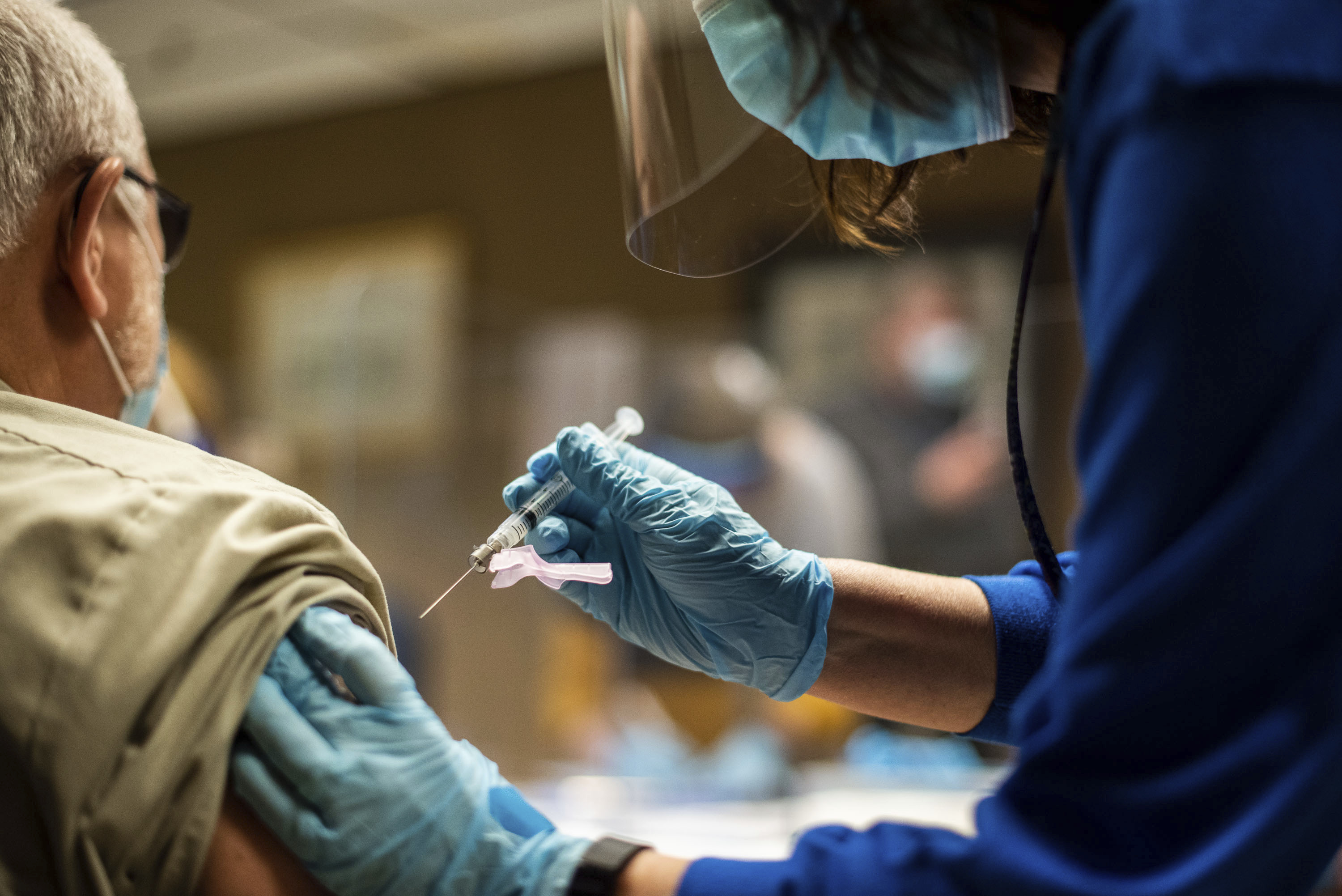 Tyson Foods team members receiving COVID-19 vaccines from health officials at the company’s Wilkesboro, North Carolina facility