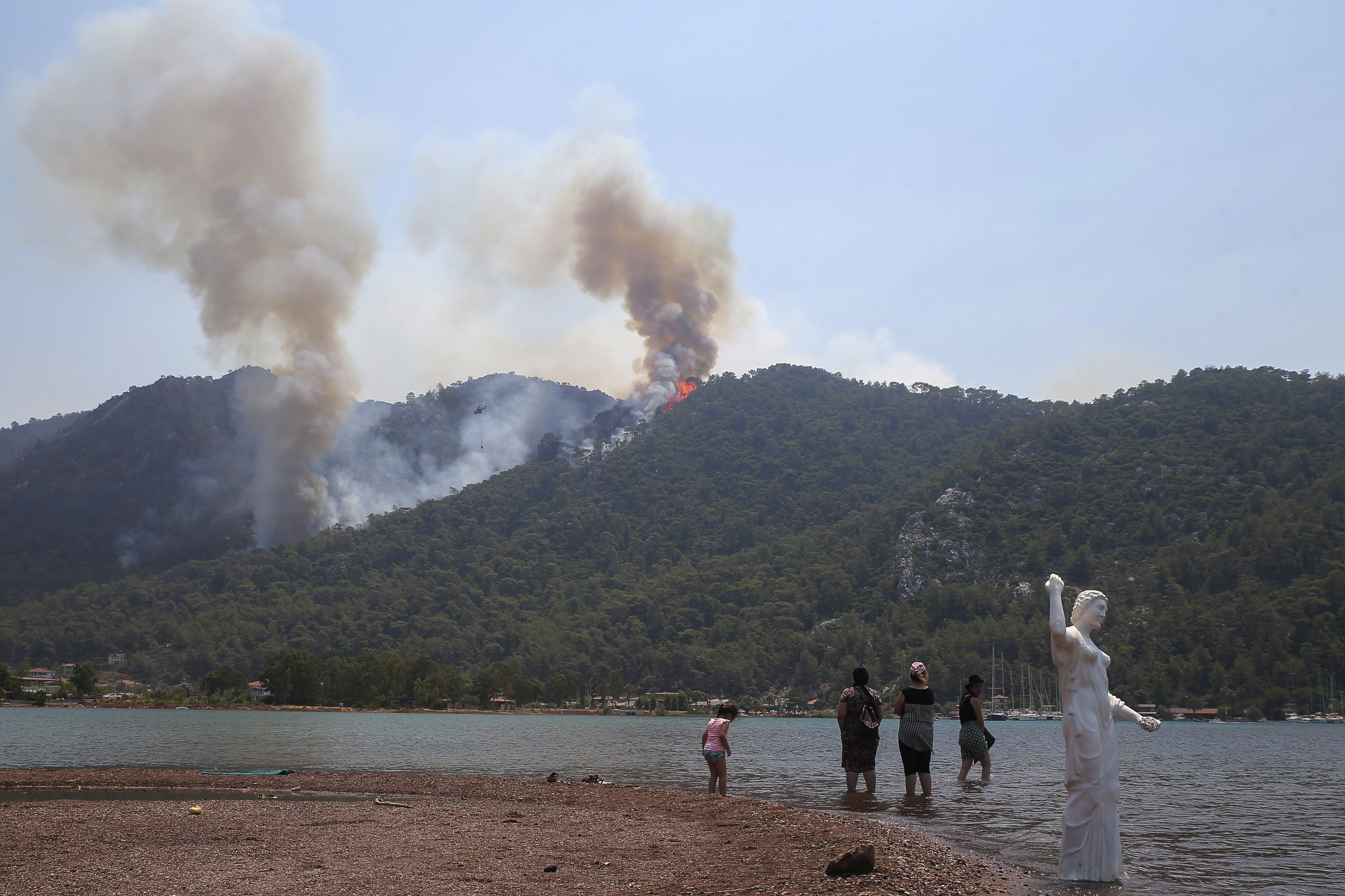 In Turkey, wildfires described as the worst in decades have swept through swaths of the southern coast for the past 10 days, killing eight people