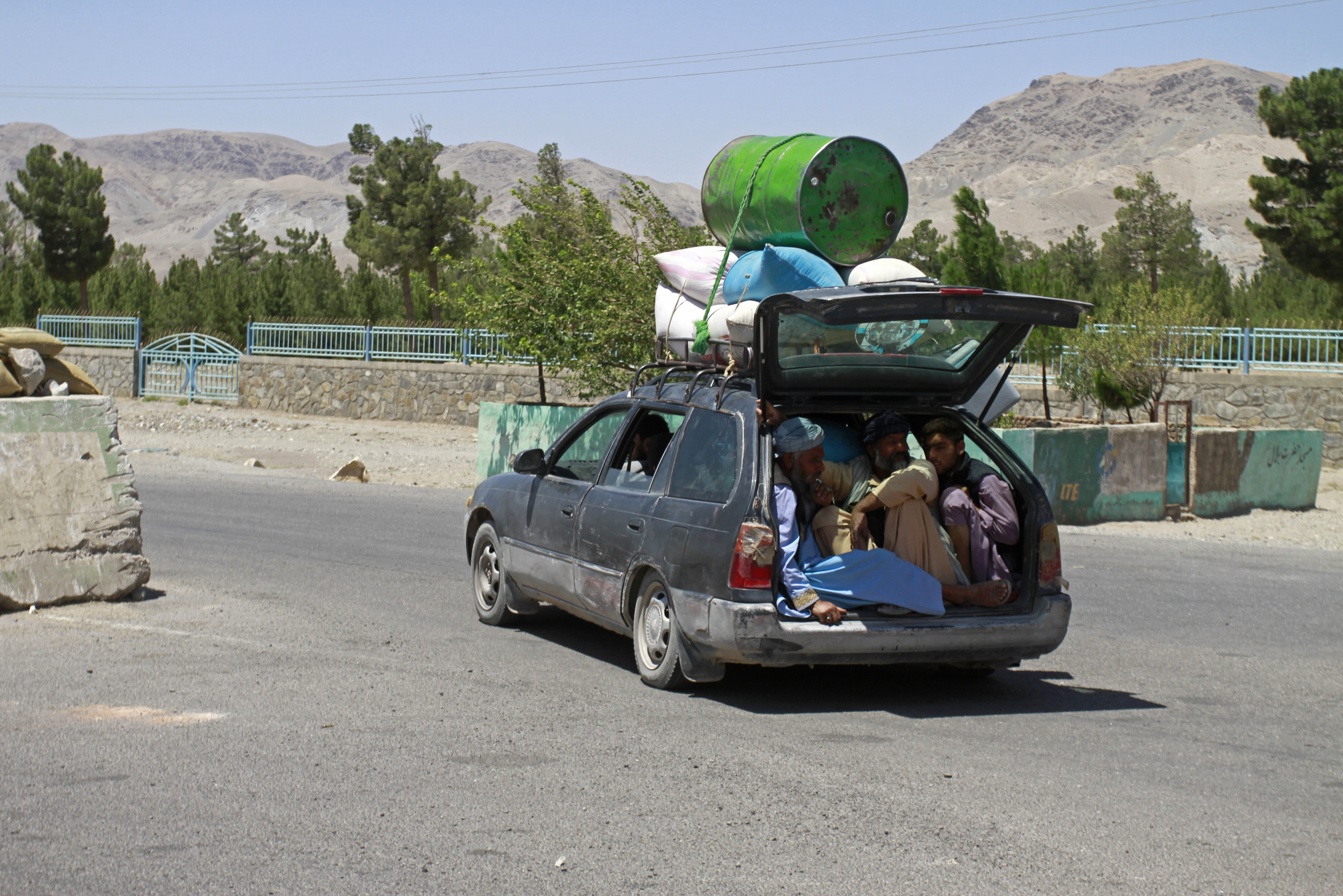 Afghans flee fighting between the Taliban and Afghan security forces, on the outskirts of Herat, 640km (397 miles) west of Kabul, Afghanistan