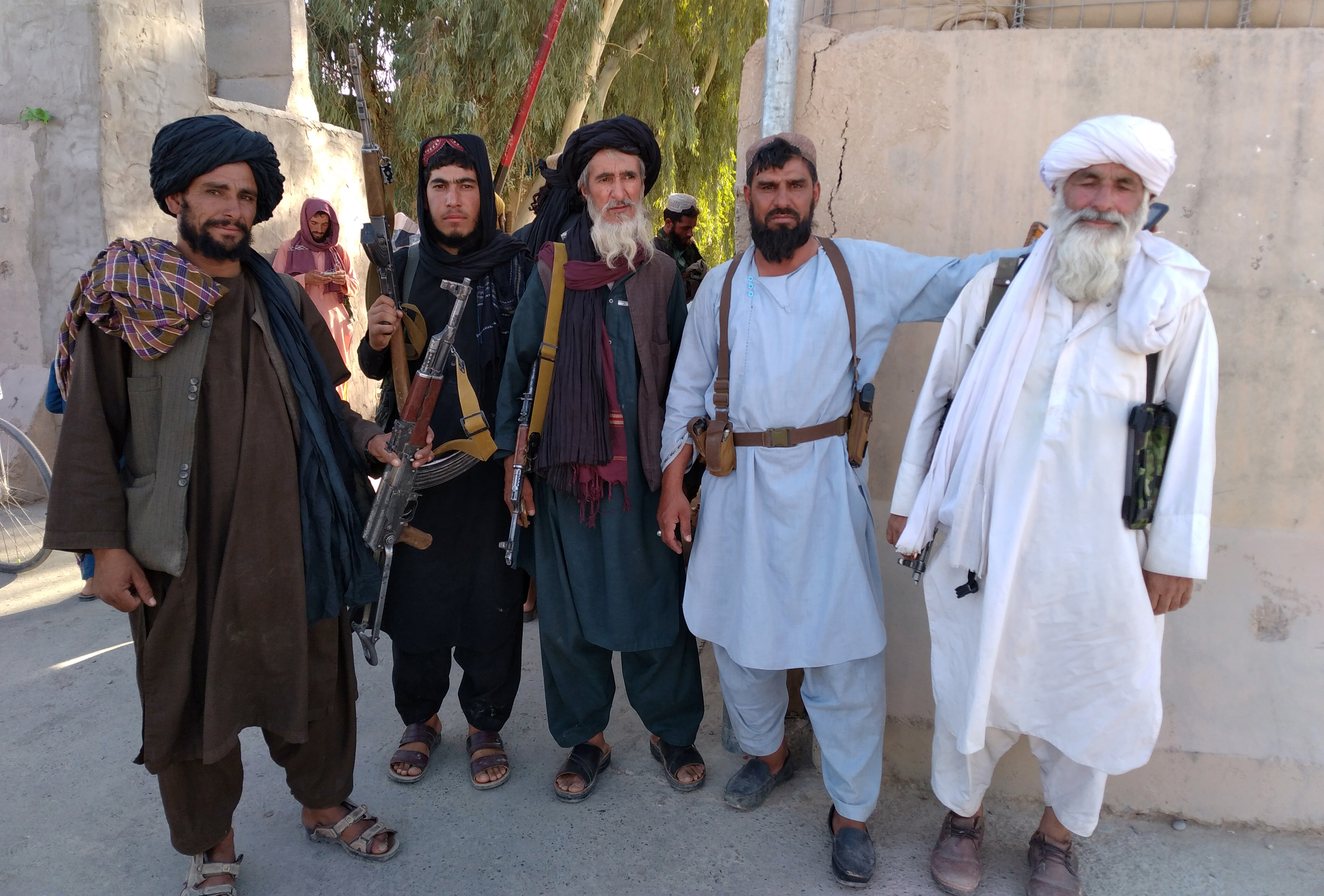 Taliban fighters are seen in the city of Farah