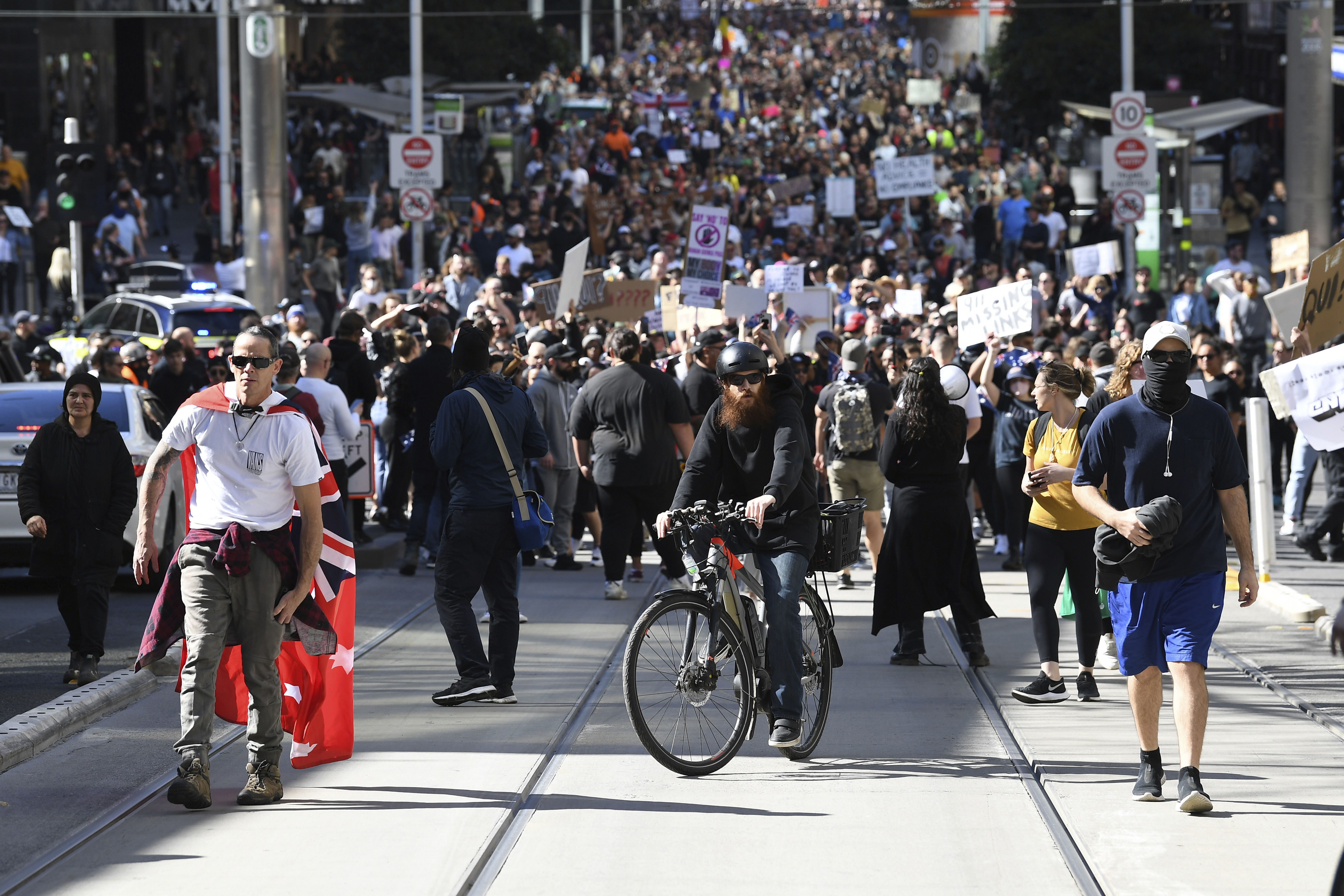 Hundreds of protesters march in an anti-lockdown protest in Melbourne, on August 21