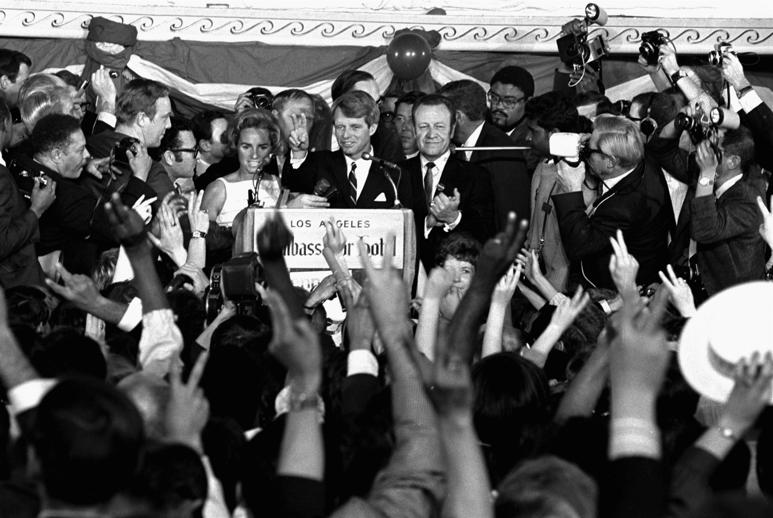 Senator Robert F Kennedy addresses campaign workers moments before being shot in Los Angeles. At his side are his wife, Ethel, and his California campaign manager, Jesse Unruh, speaker of the California Assembly, June 5, 1968