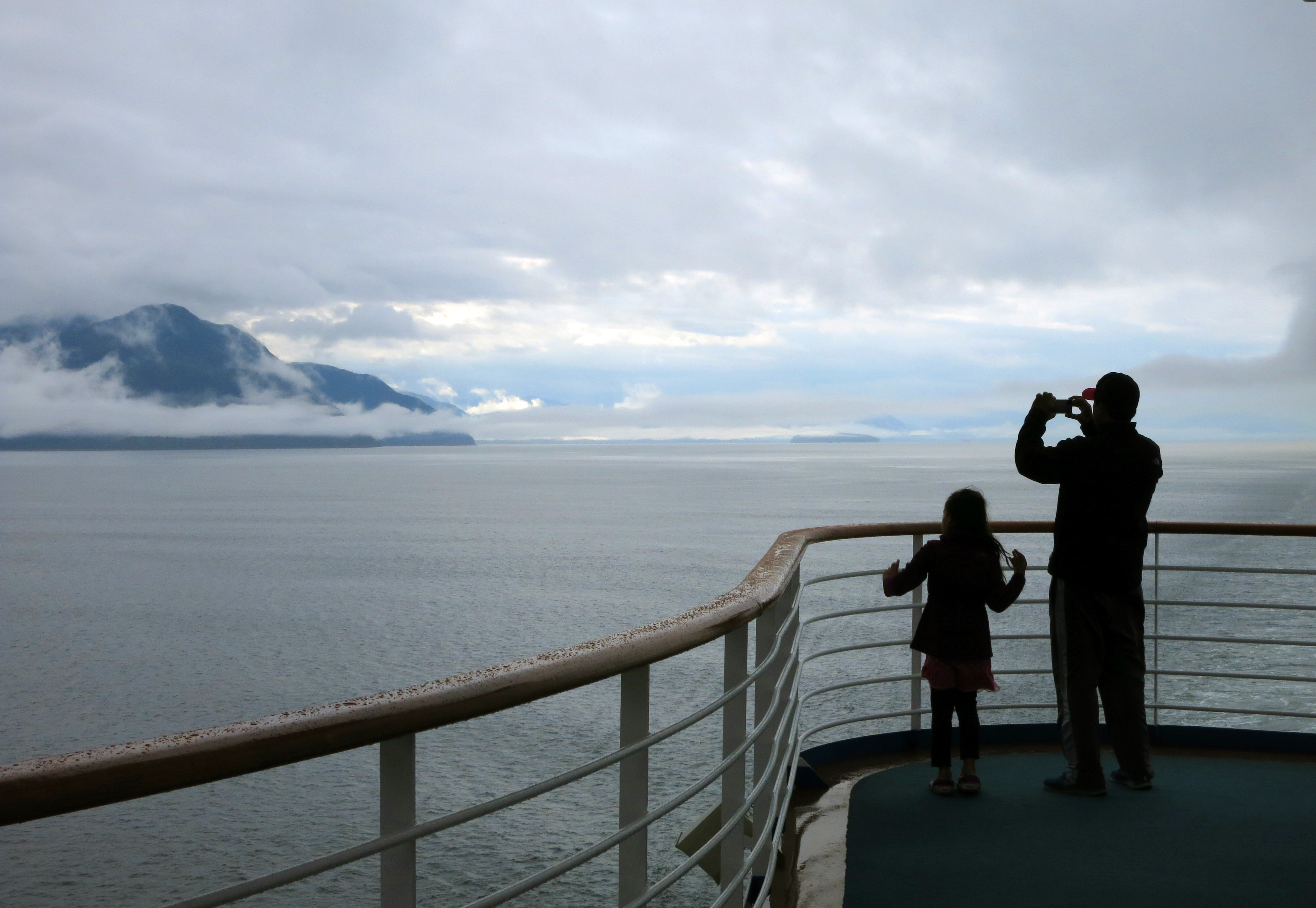 Cruise ship passengers take photos of Alaska’s Inside Passage