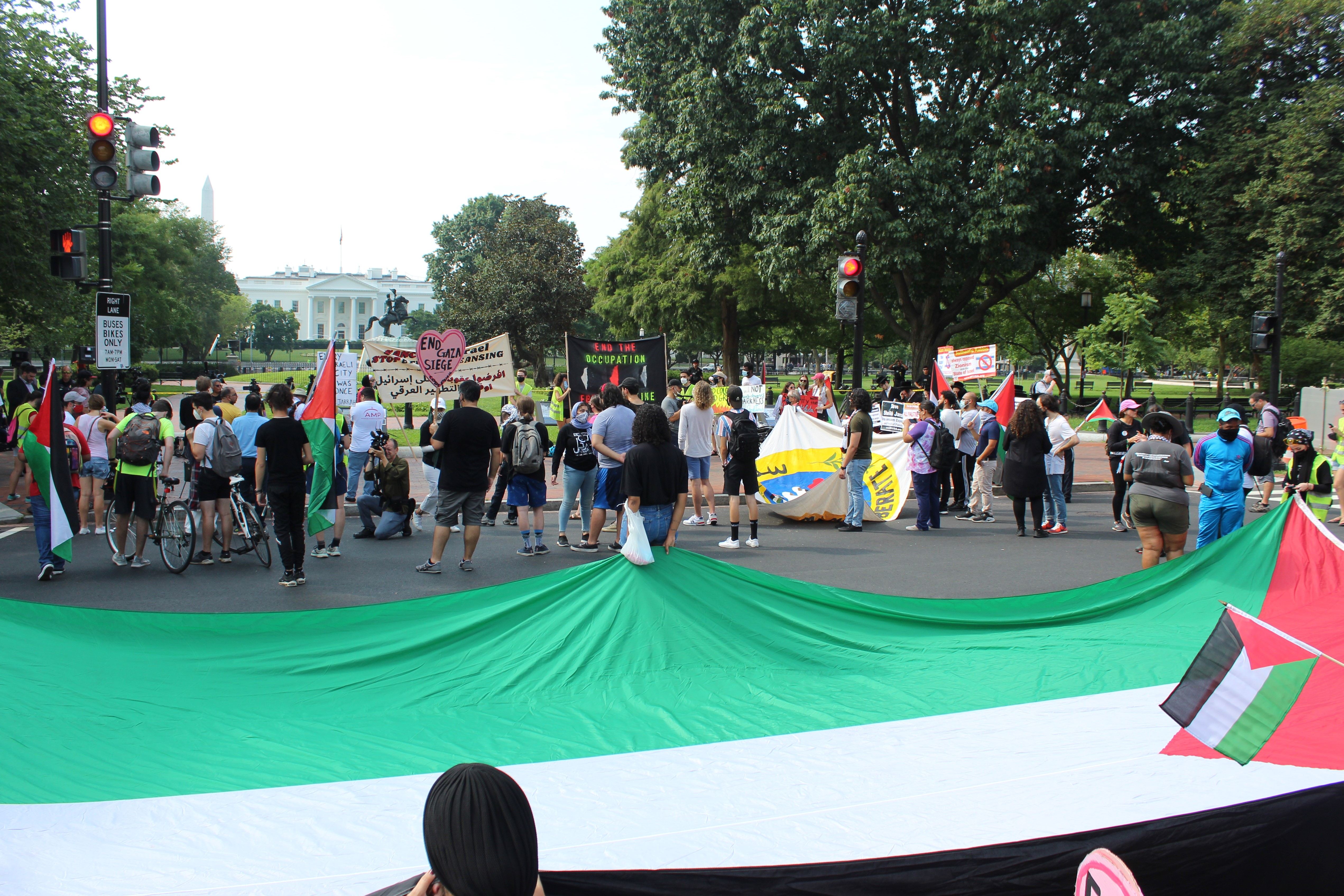Dozens of Palestinian rights advocates gather in front of the White House, August 26