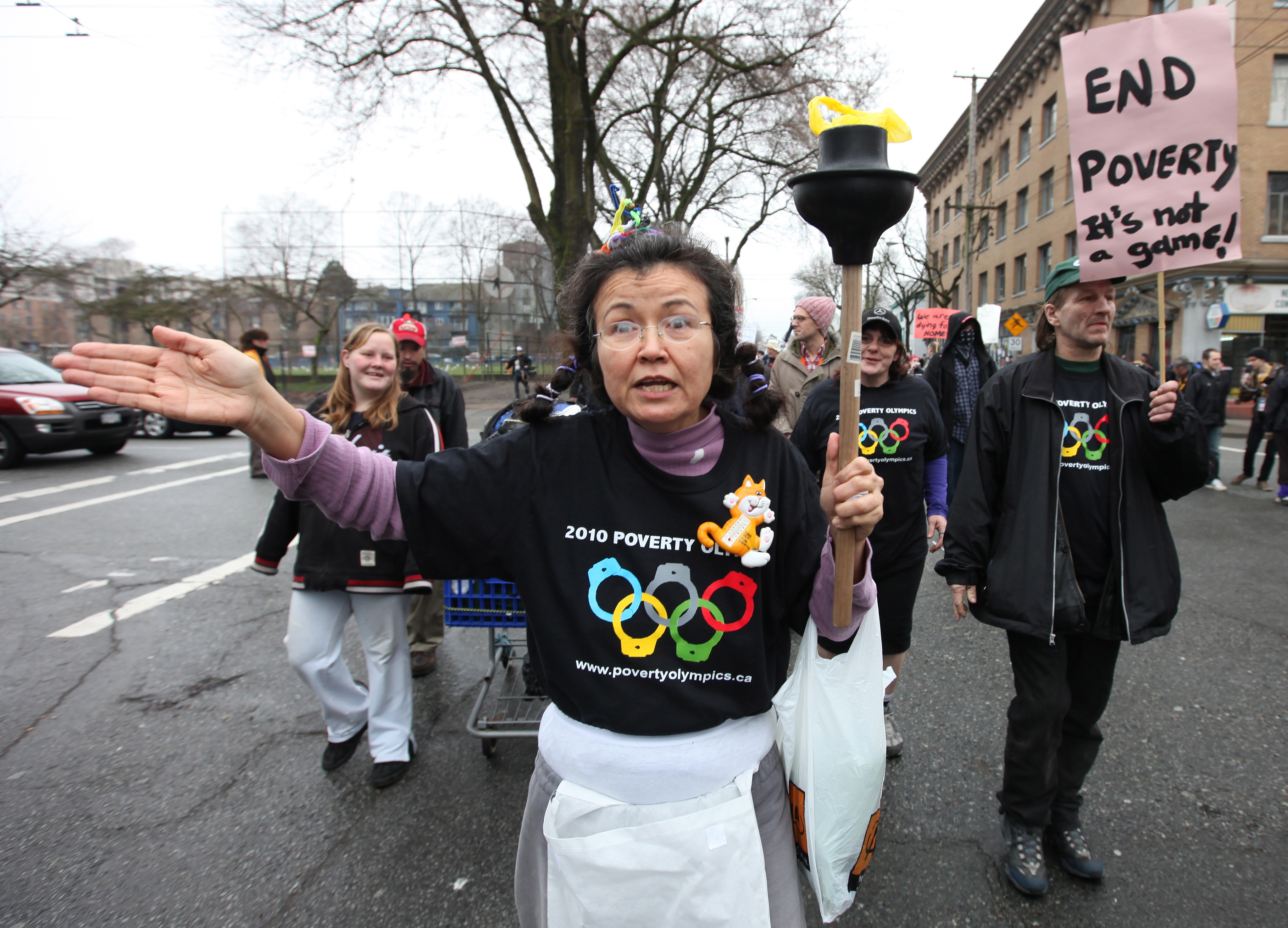 Protesters in Canada started the 'Poverty Olympics Torch Relay' using a toilet plunger in place of an Olympic torch [File: Barbara Walton/EPA]