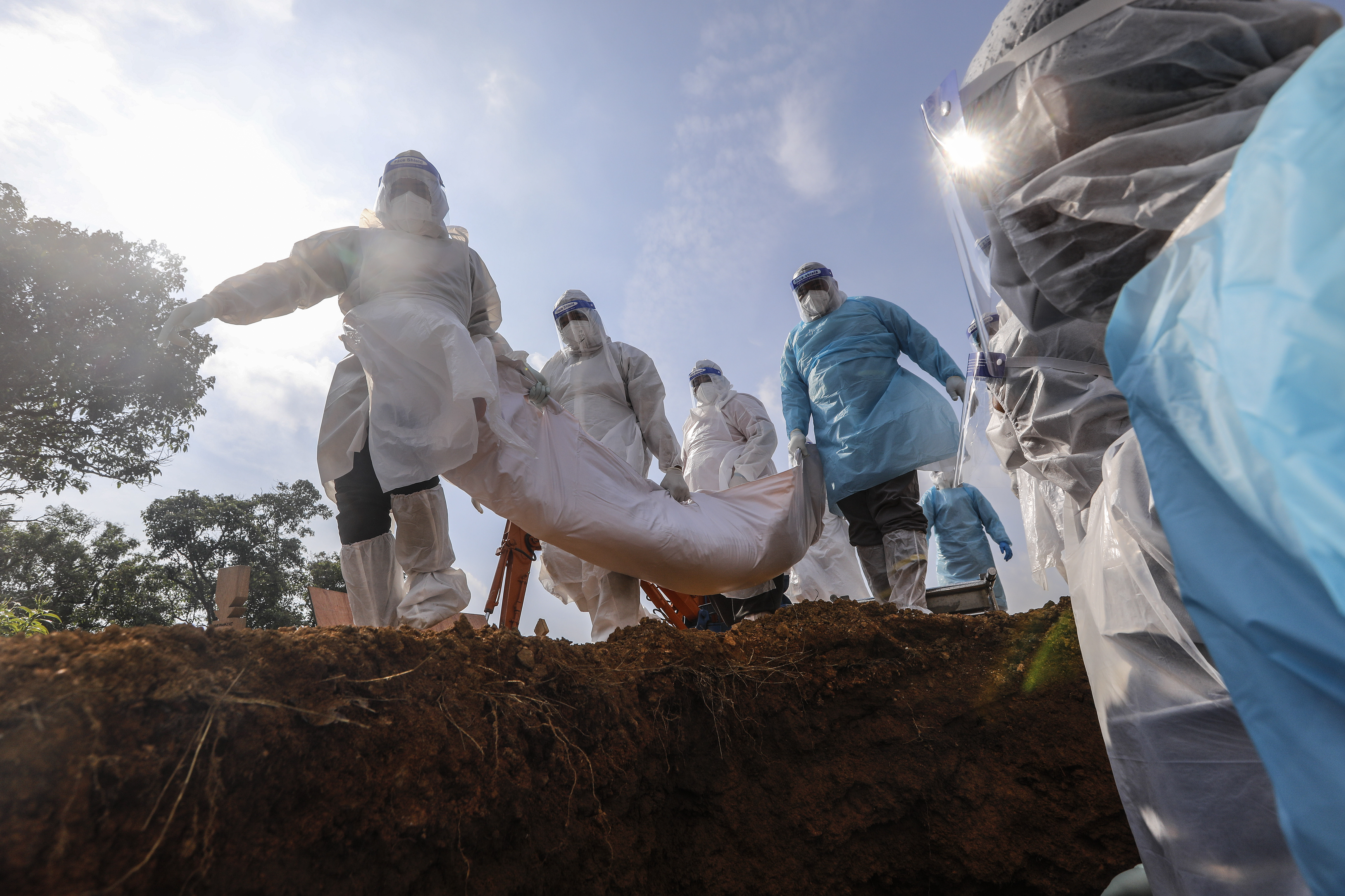 Malaysia’s death toll from the coronavirus pandemic has reached 12,510 as hospitals are pushed to the limit and more patients forced to isolate at home